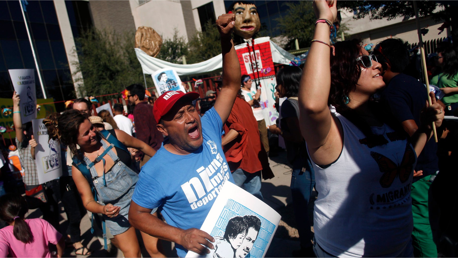 People protest against Immigration and Customs Enforcement at their headquarters in Phoenix, Arizona October 14, 2013.