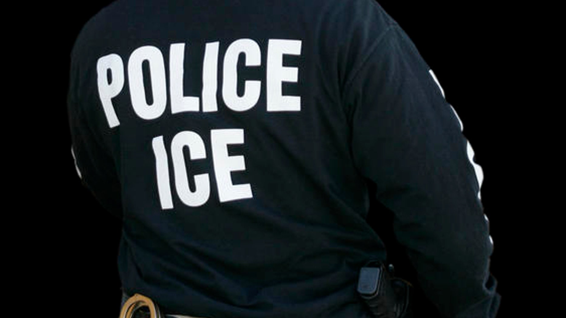 FILE: An Immigration and Customs Enforcement agent enters a restaurant to remove evidence in Cheektowaga, N.Y.