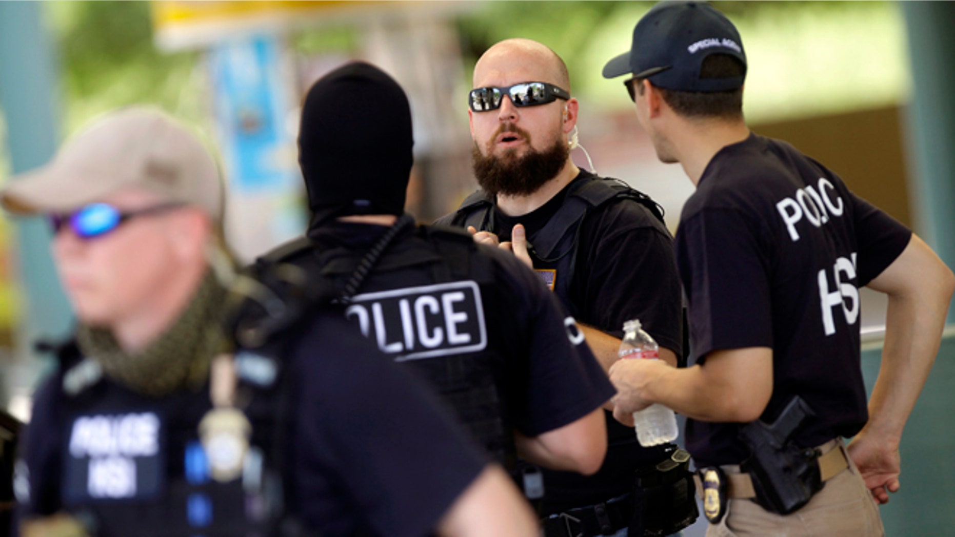 FILE: August 17, 2013: ICE Homeland Security Investigations agents during an investigation in Phoenix, Ariz .