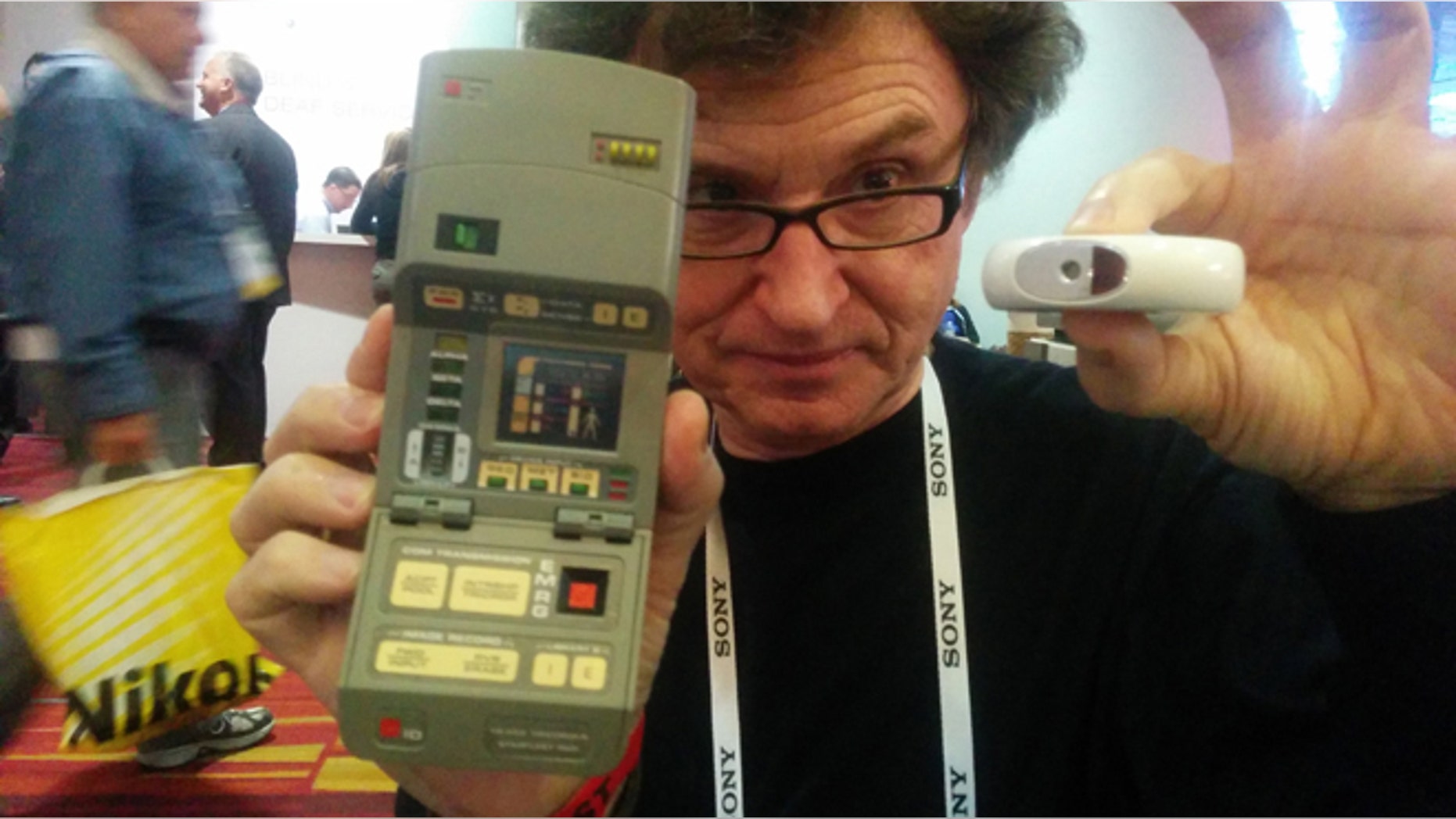 In Walter De Brouwer's right hand, the tricorder used on the TV series "Star Trek." In his left hand, a real-world version he has invented.