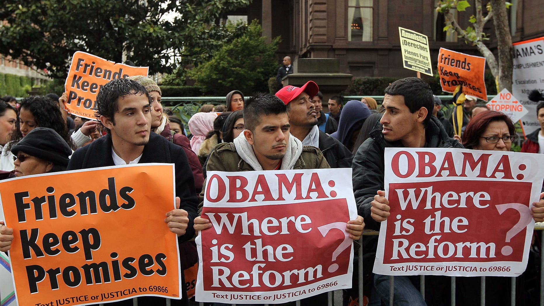 SAN FRANCISCO - MAY 25: A group carries signs asking for immigration reform as they protest outside of the Fairmont Hotel before U.S. President Barack Obama arrives for a fundraiser May 25, 2010 in San Francisco, California. Hundreds of protestors from different political groups staged the demonstration at a campaign fundraiser for U.S. Sen. Barbara Boxer (D-CA). (Photo by Justin Sullivan/Getty Images)
