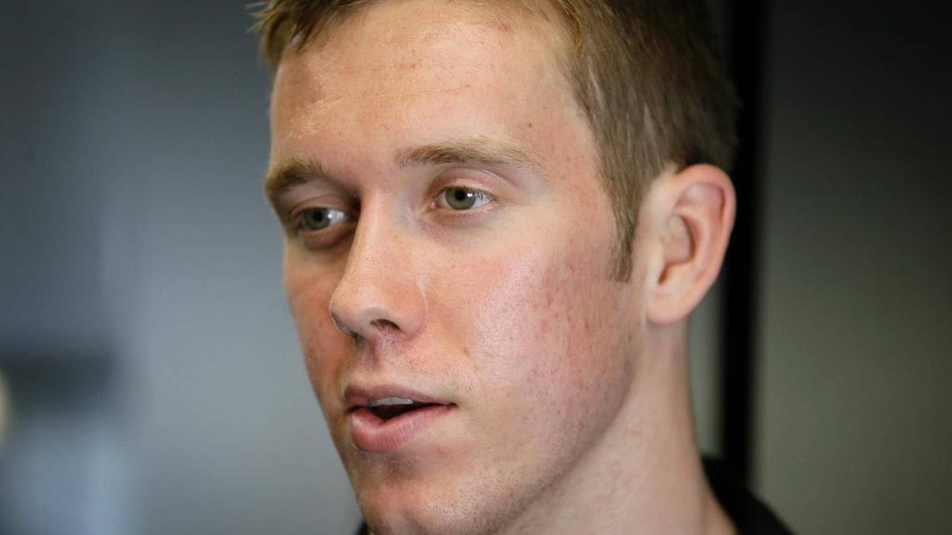 FILE - In this July 10, 2014, file photo, IndyCar driver Jack Hawksworth speaks during an interview at Iowa Speedway in Newton, Iowa. So much has changed for the 24-year-old IndyCar driver in such a short time. Last season, he didn’t even have a ride until March. Now he’s attending conventions and auto shows after joining A.J. Foyt Racing in the fall to drive the team’s second car. It is quite the follow-up to a promising rookie campaign. (AP Photo/Charlie Neibergall, File)