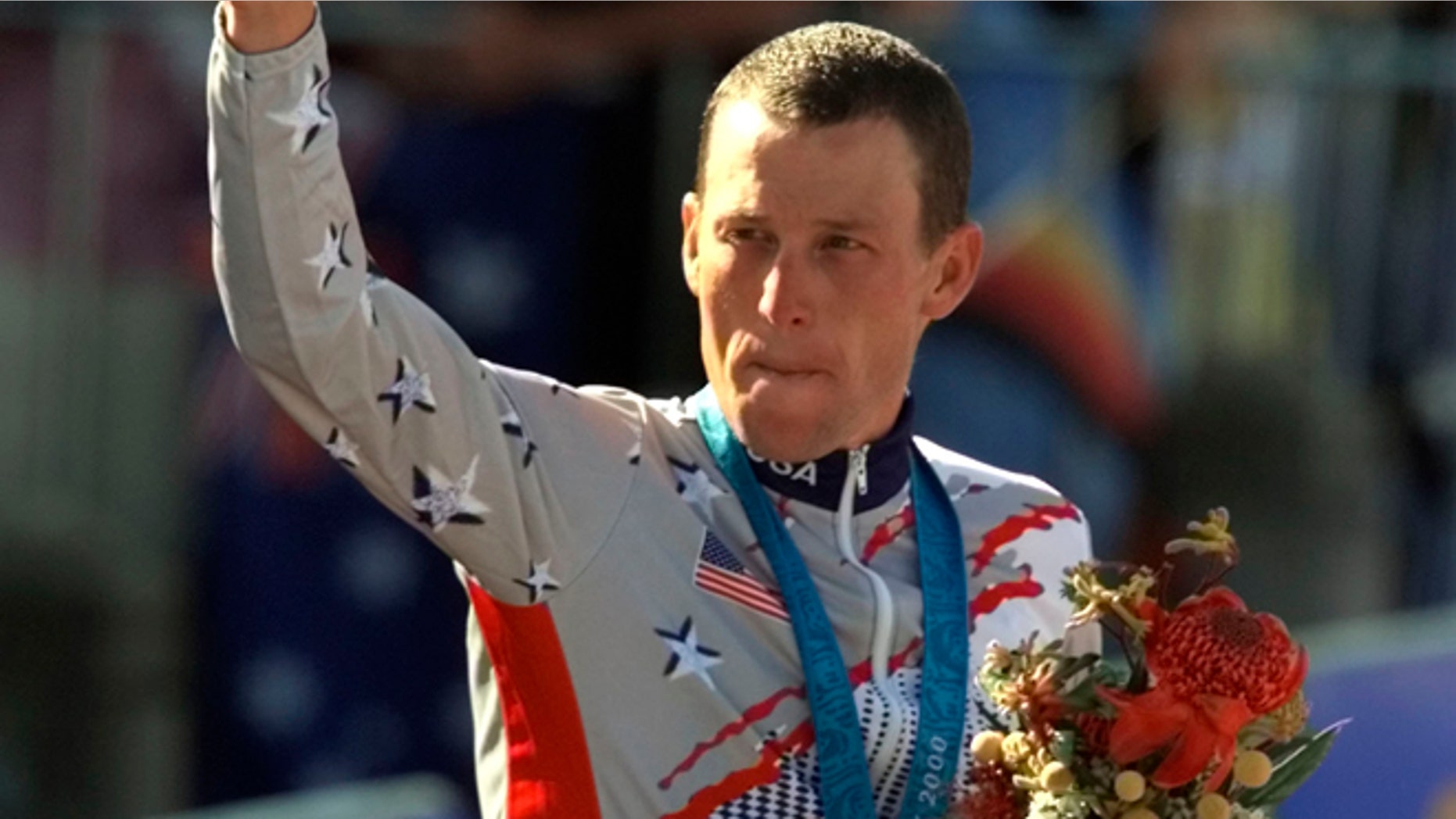 Sept. 30, 2000: This file photo shows U.S. cyclist Lance Armstrong waving after receiving the bronze medal in the men's individual time trials at the Summer Olympics in Sydney, Australia.