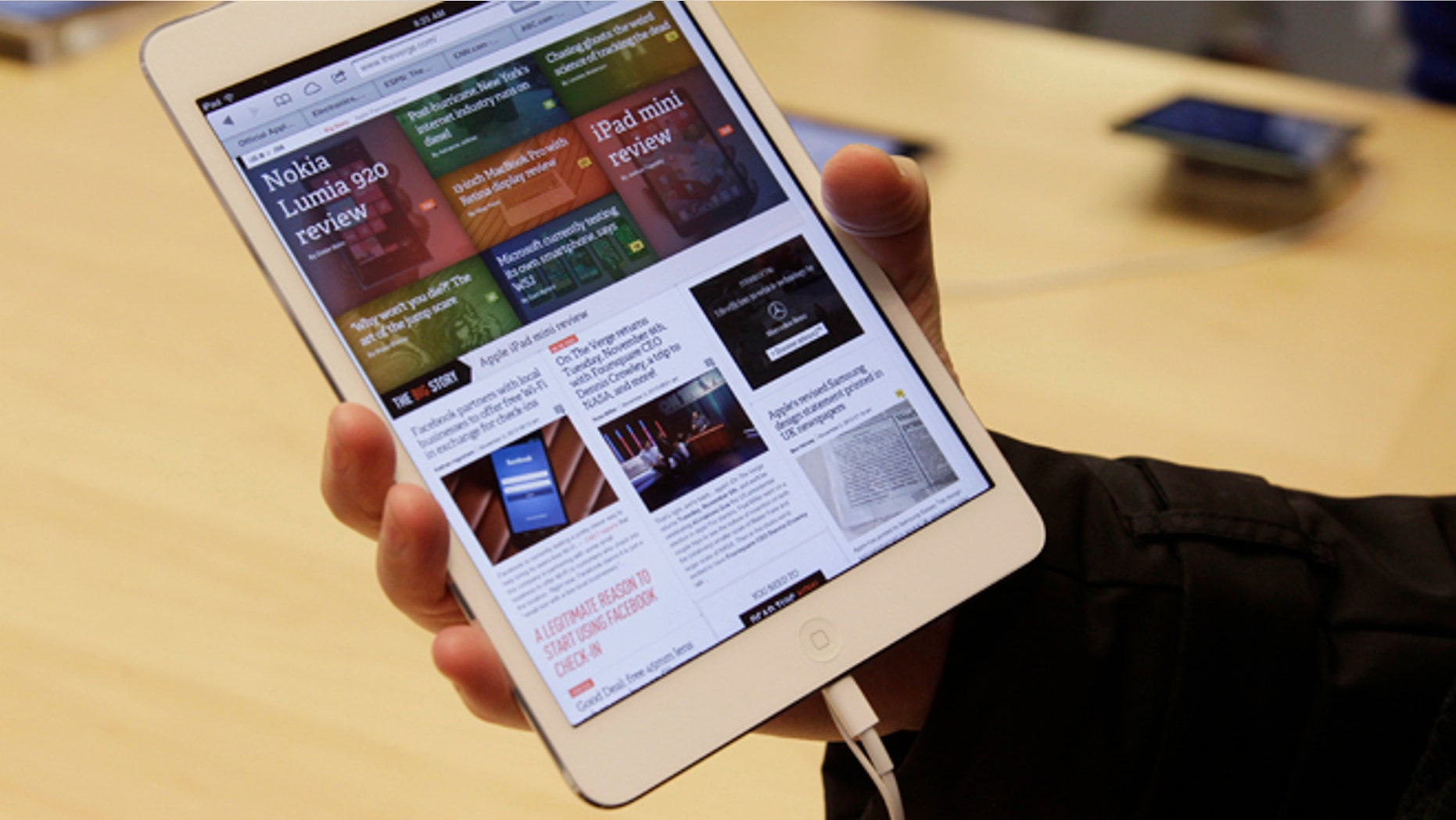 FILE 2012: A shopper checks out the new Apple iPad mini at the Apple store on Michigan Ave. in Chicago.