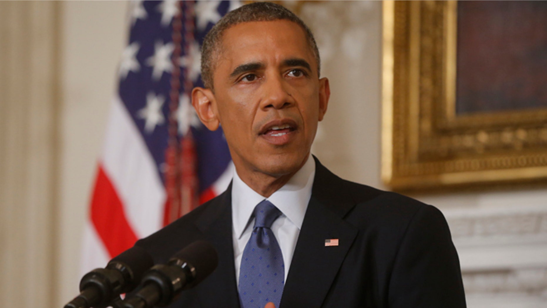 This Aug. 7, 2014, file photo shows President Barack Obama talking about the situation in Iraq in the State Dining Room at the White House in Washington.