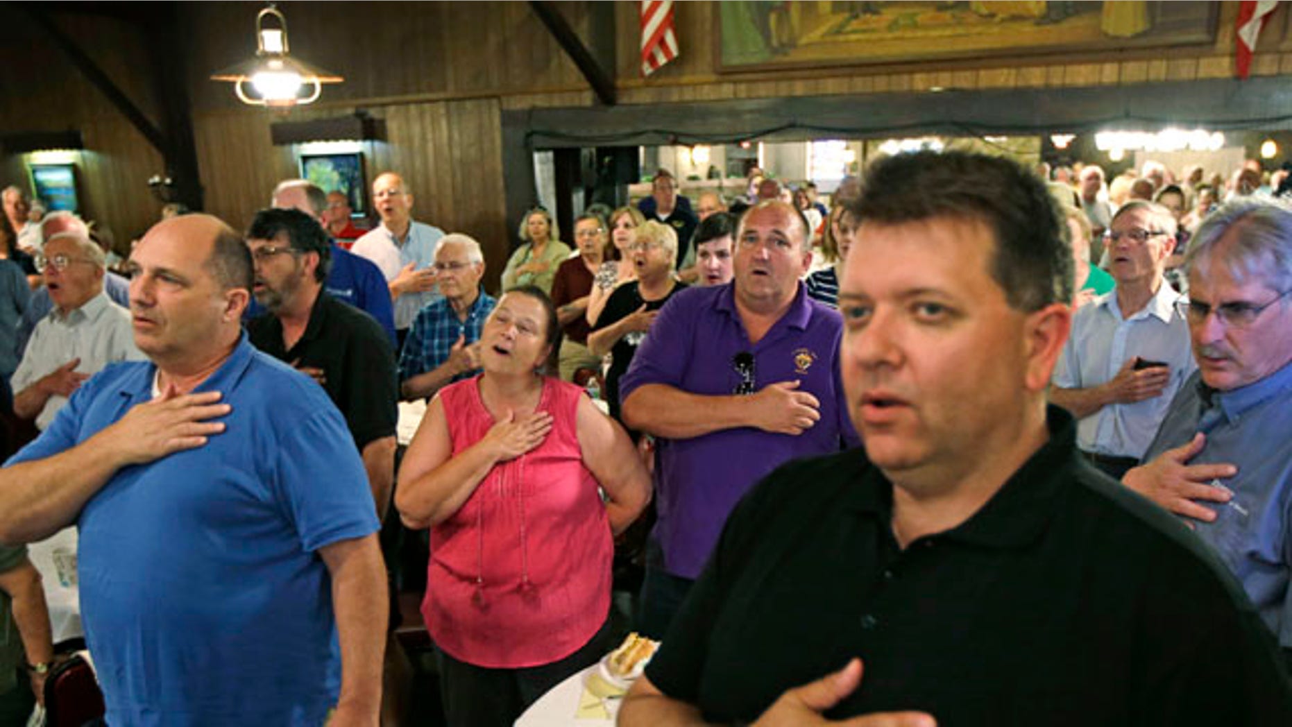 May 29, 2013: Tea party members sing the Star Spangled Banner at the start of a meeting in Cincinnati.