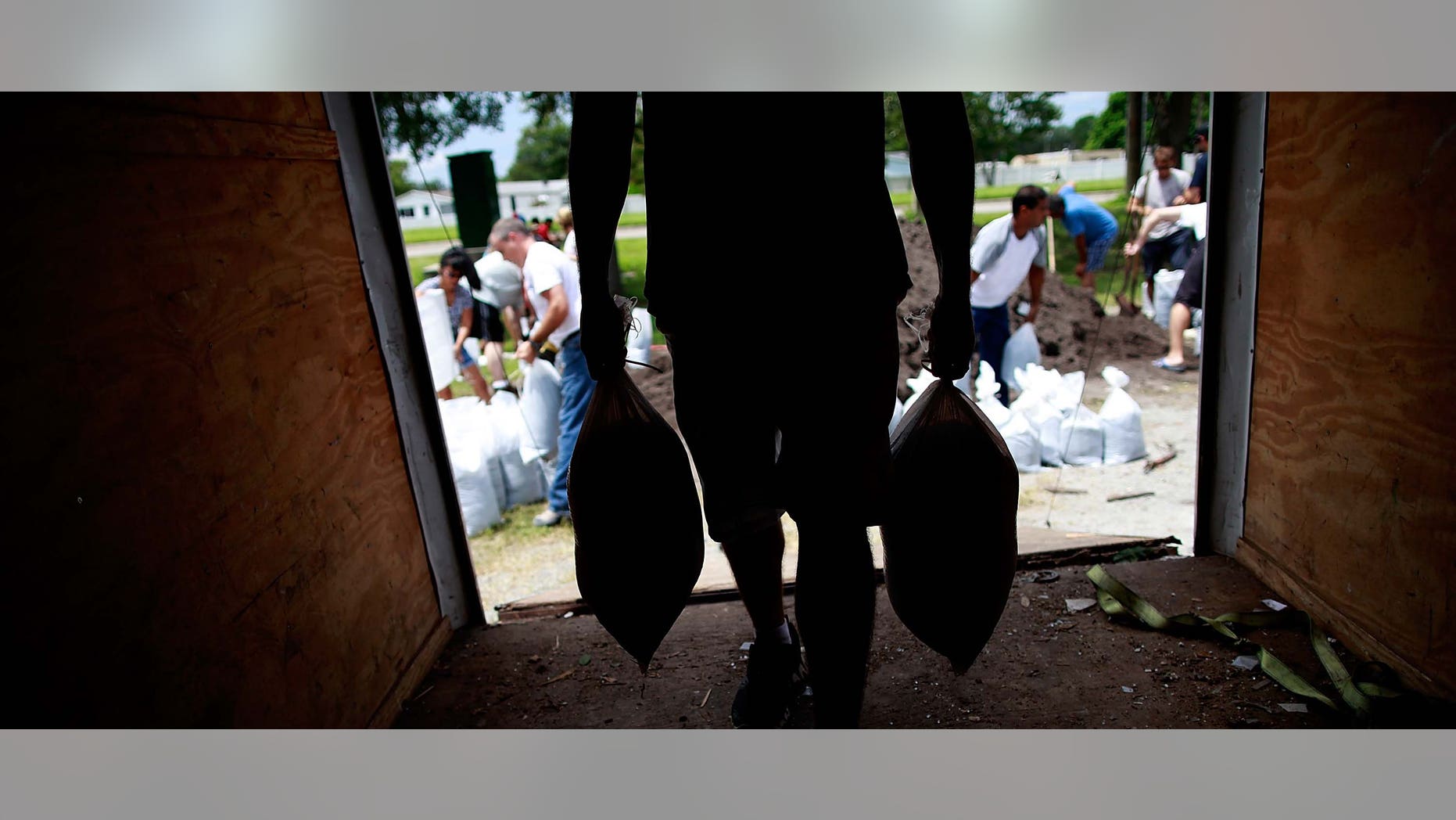 TAMPA, FL - AUGUST 25: Tampa area residents make preparations for the arrival of Tropical Storm Issac by filling sandbags at a Hillsborough County Public Works Service Center on August 25, 2012 in Tampa, Florida. Tampa area residents wait for Tropical Storm Isaac as they prepare for the Repulican National Convention which will be held in Tampa during the week of August 27th. (Photo by Tom Pennington/Getty Images)