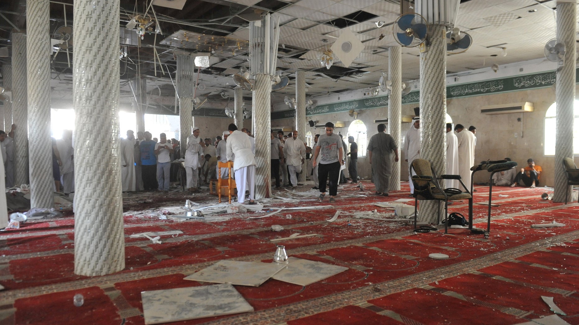 May 22, 2015 - Family members of victims and well wishers are seen after a suicide bomb attack at the Imam Ali mosque in the eastern province of Qatif, Saudi Arabia. A suicide bomber blew himself up at the Shiite mosque in during Friday prayers, residents said.