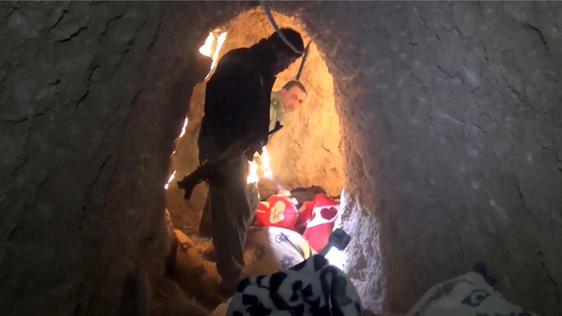 Nov. 22, 2015: Kurdish security forces are seen in a tunnel complex under the city of Sinjar, northern Iraq that were used by Islamic State fighters to move undetected and avoid coalition airstrikes before the town was retaken from the militants.