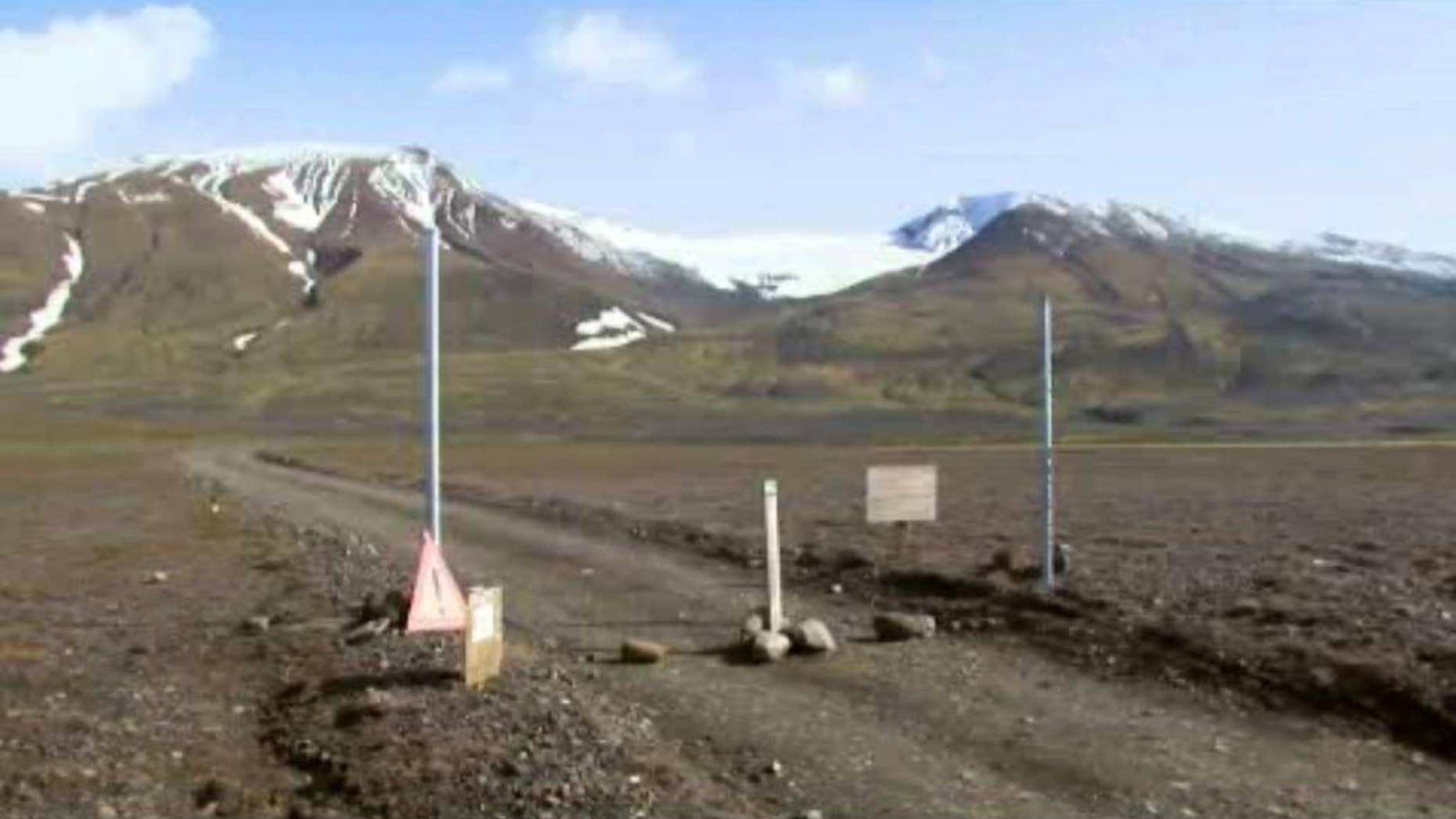 In an in an image from an Aug. 19, 2014 video, a sign is posted on the road next to Bardarbunga, a subglacial stratovolcano located under Iceland's largest glacier. On Saturday, Aug. 23, 2014, Iceland closed airspace over the Bardarbunga volcano on Saturday after the Meteorological Office said an eruption had begun under the ice of Europe’s largest glacier. The English portion of the sign reads, ""Uncertainty phase due to unrest in Bardarbunga". (AP Photo/Courtesy Channel 2 Iceland)