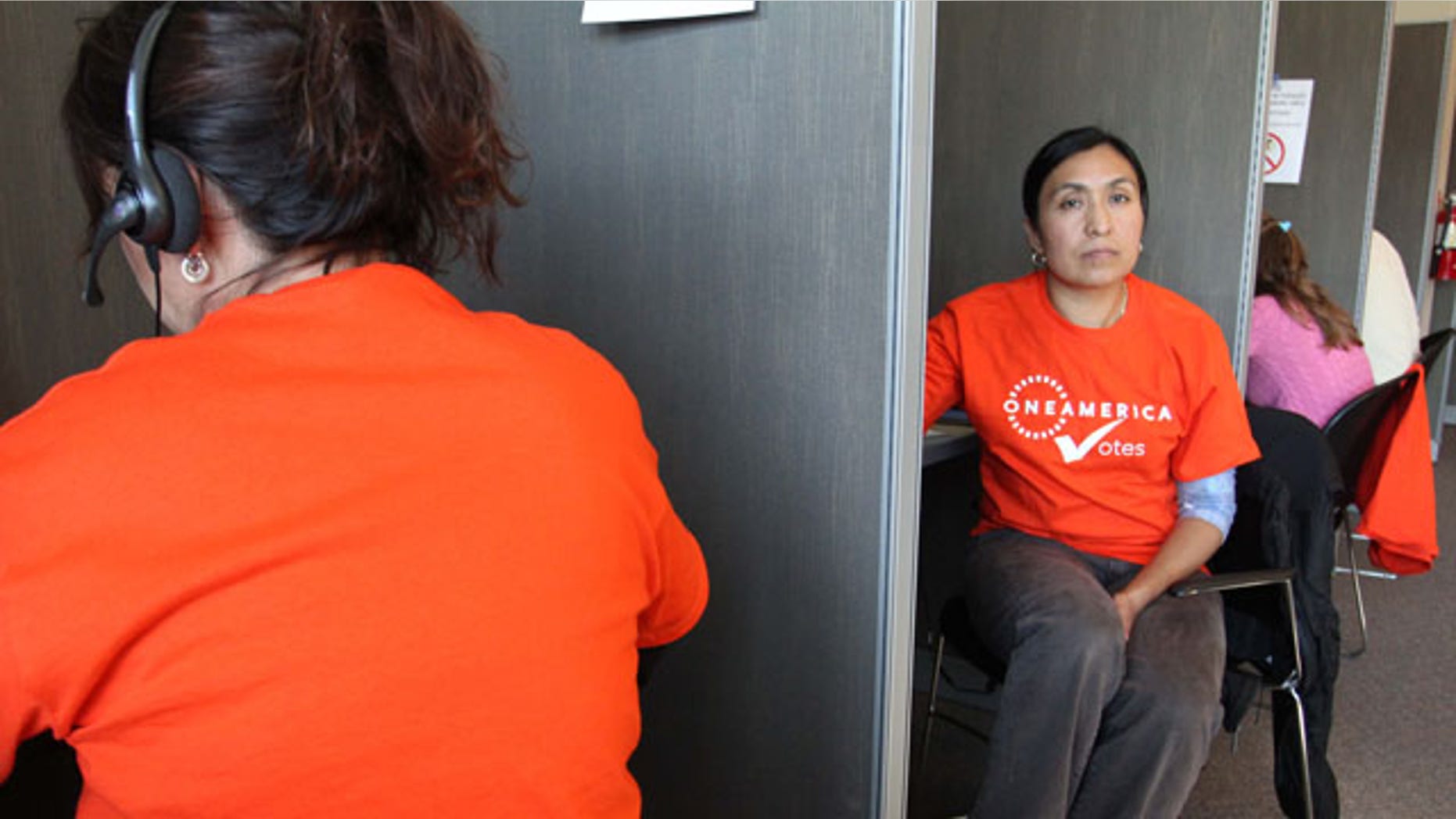 Oct. 16: Maria Gianni, an illegal immigrant, volunteers with OneAmerica Votes at a phone bank in Seattle. The organization has launched a vote drive targeting naturalized citizen voters.