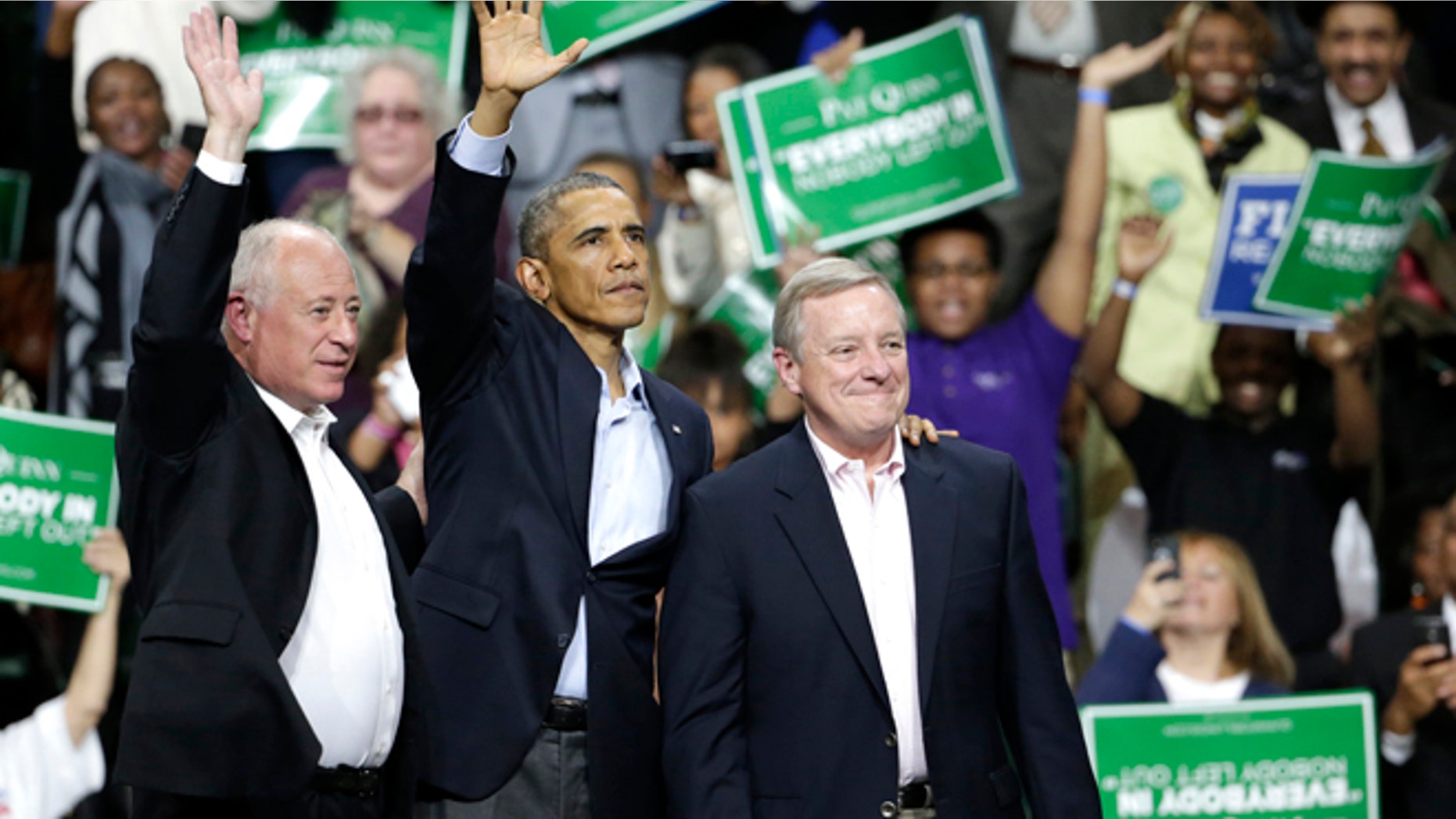 In this Sunday, Oct. 9, 2014 photo, President Barack Obama, center, stands with Illinois Gov. Pat Quinn, left, and U.S. Sen. Dick Durbin, during an early voting and campaign rally for Illinois Gov. Pat Quinn at Chicago State University Sunday in Chicago.