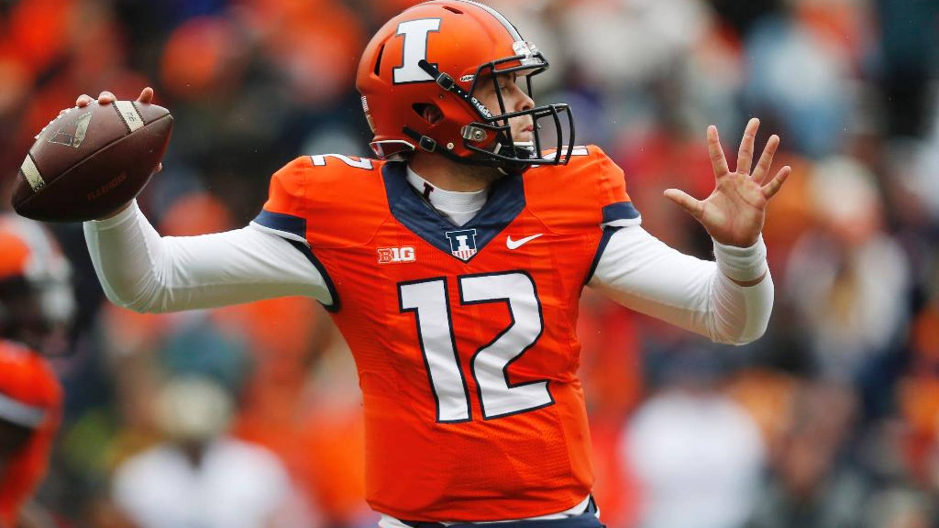 FILE - In this Oct. 4, 2014 file photo, Illinois quarterback Wes Lunt throws again Purdue during an NCAA college football game in Champaign, Ill. Lunt will be back under center when Illinois faces Iowa Saturday in Champaign after missing the last three games after breaking a bone in his left leg against Purdue. Without him Illinois used the run more and picked up a win against Minnesota. But the Illini lost at Wisconsin and Ohio State.(AP Photo/Andrew A. Nelles, File)