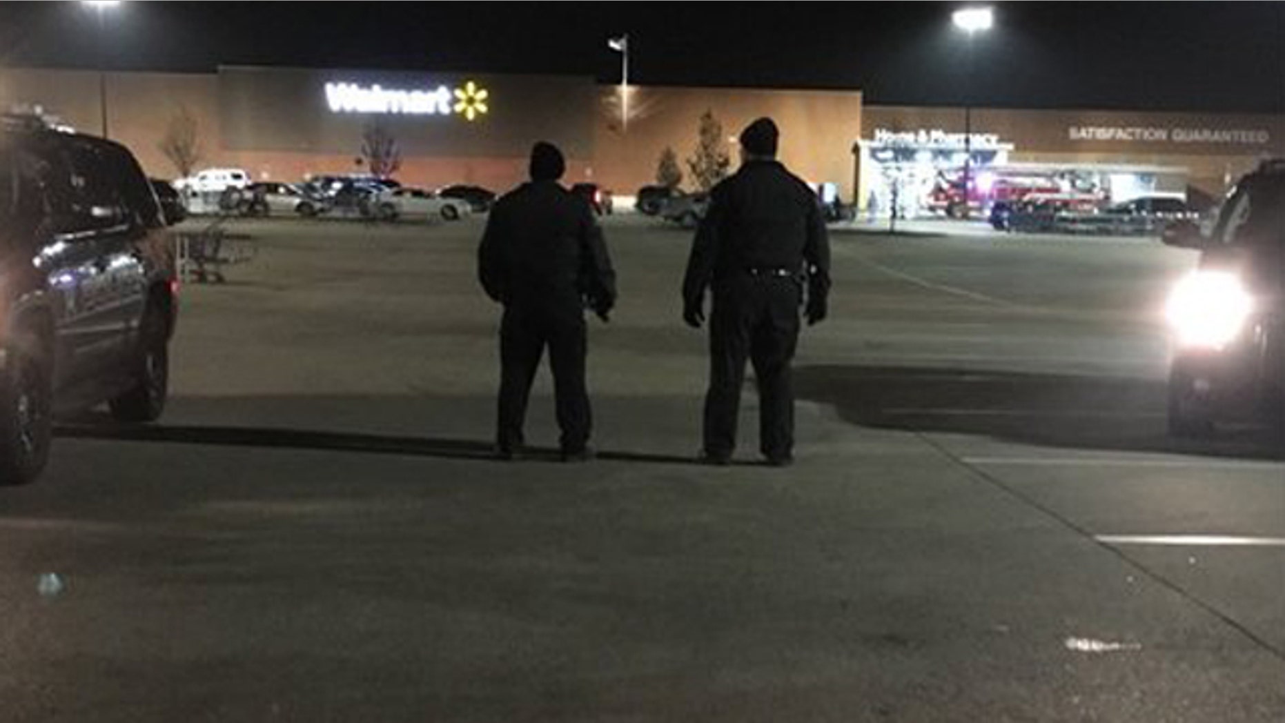 Dec. 3, 2015: Police patrol the parking lot of a Walmart in Darien, Ill. after a shooting left one person injured. (Fox 32 Chicago)