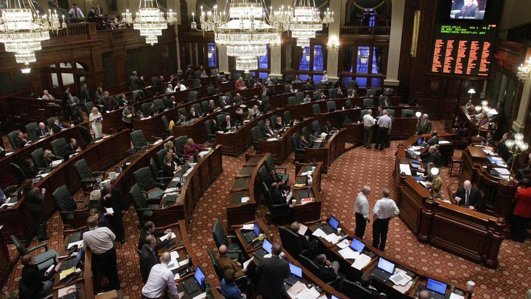 Illinois lawmakers tackle state budget legislation while on the House floor during session at the Illinois State Capitol in Springfield, Ill., Tuesday, Jan. 11, 2011. (AP Photo/Seth Perlman)