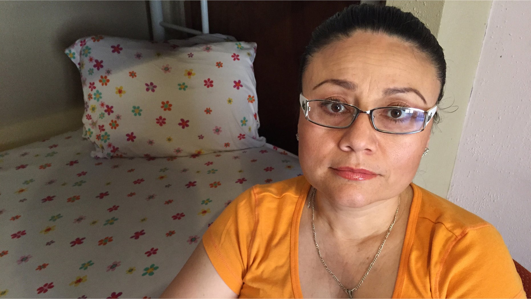 In this Thursday, July 30, 2015 photo, Rosa Robles Loreto sits in her small room at Southside Presbyterian Church in Tucson, Ariz., where she has taken sanctuary from deportation for a year. Robles Loreto, 42, says she is not leaving the church until the government assures her she will not be deported. (AP Photo/Astrid Galvan,File)