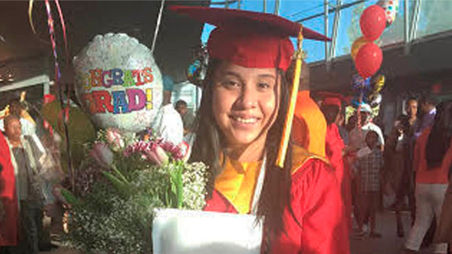 In this May 21, 2016 photo provided by Jessica Barcenas, Ivonne Barcenas Garcia poses in her cap and gown after her high school graduation held at the University of Georgia's Stegeman Coliseum in Athens, Ga. Growing up in Athens, Ivonne Barcenas, 18, had hopes of attending the University of Georgia. But a state law prohibits immigrants without permanent legal status from attending top public universities. Barcenas, whose family came from Mexico when she was 3, is among dozens of students awarded a private scholarship to attend Eastern Connecticut State University in the fall. The scholarship program helps immigrants from states with policies like Georgia's to attend and pay for college. (Jessica Barcenas via AP)