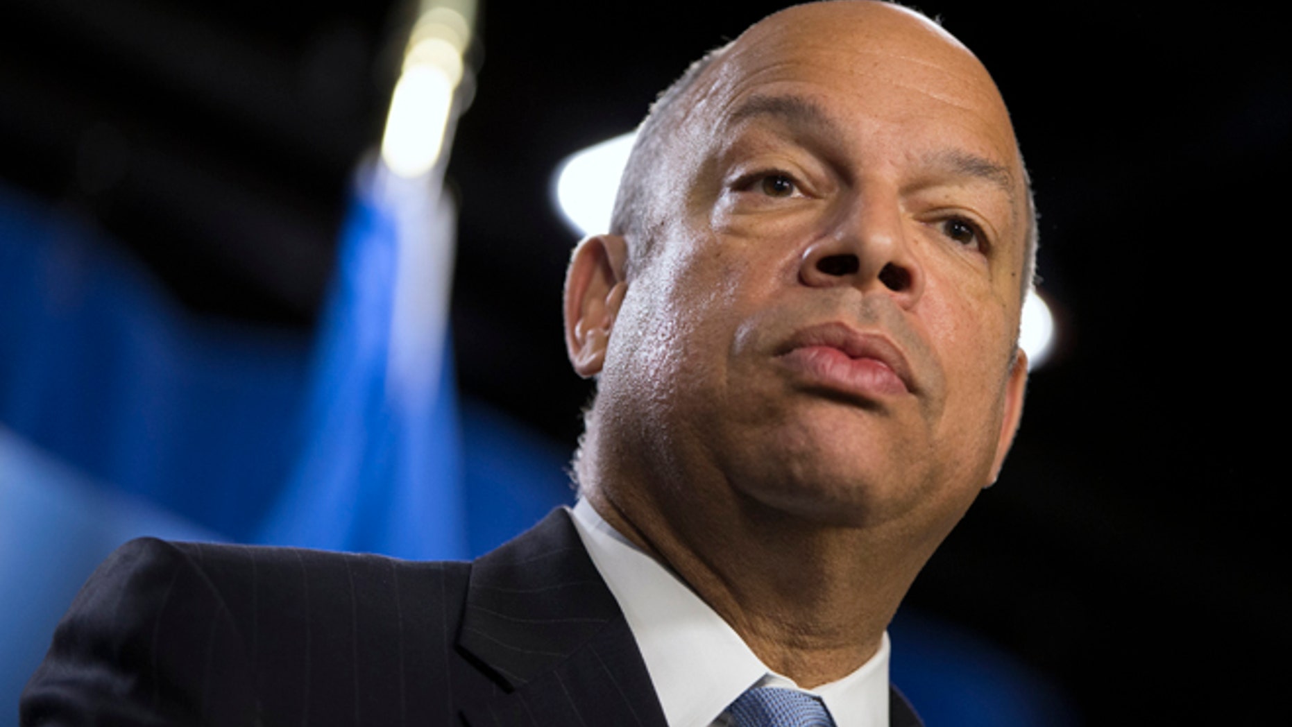 FILE - In this March 18, 2014, file photo, Department of Homeland Security Secretary Jeh Johnson speaks during a news conference in Washington. Johnson, who's conducting a politically charged review of the nation's deportation policy, said Thursday, May 15 he's looking at making changes to a much-criticized program that runs people booked for local crimes through a federal immigration database.(AP Photo/ Evan Vucci, File)