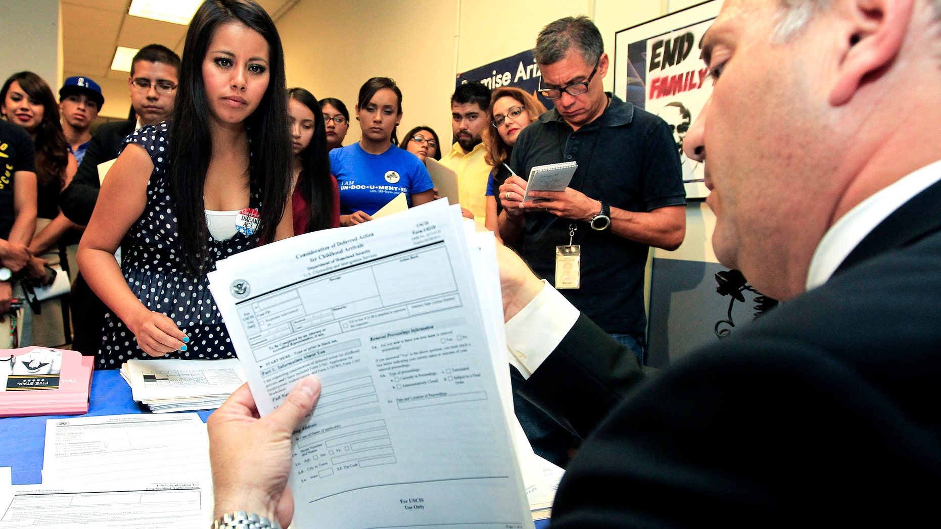 Schools and consulates have been flooded with requests for documents after President Barack Obama announced a new program allowing undocumented immigrants to apply for two-year renewable work permits.