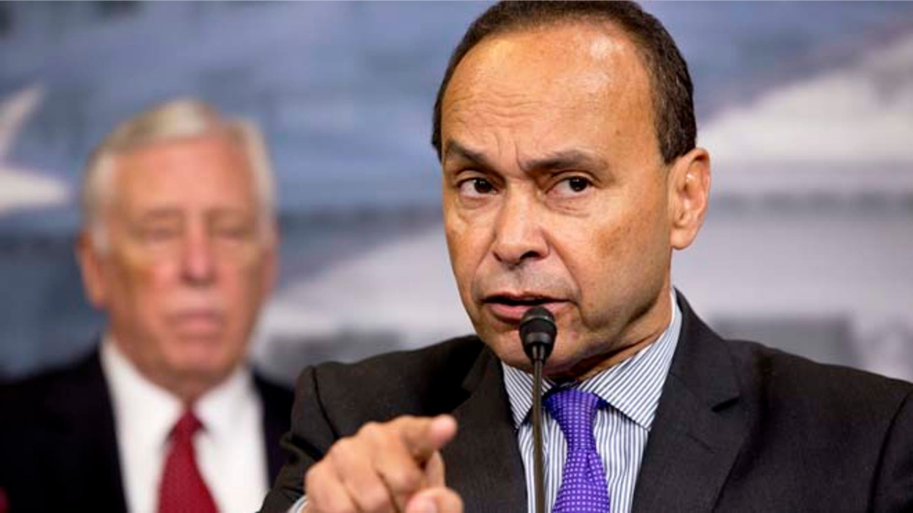 Rep. Luis Gutierrez, D-Ill., speaks during a news conference about immigration raids targeting Central American families with children, on Capitol Hill in Washington, on Tuesday, Jan. 12, 2016. At left is House Minority Whip Rep. Steny Hoyer, of Maryland. (AP Photo/Jacquelyn Martin)