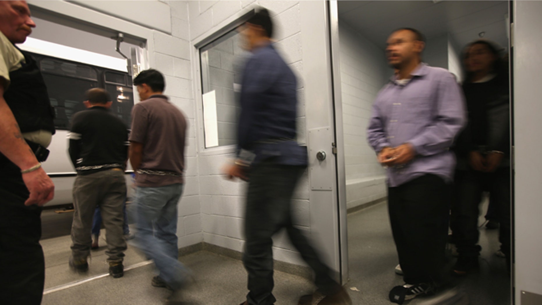 MESA, AZ - FEBRUARY 28: Honduran immigration detainees prepare to board their U.S. Immigration and Customs Enforcement (ICE), deportation flight bound for San Pedro Sula, Honduras on February 28, 2013 in Mesa, Arizona. ICE operates 4-5 flights per week from Mesa to Central America, deporting hundreds of undocumented immigrants detained in western states of the U.S. With the possibility of federal budget sequestration, ICE released 303 immigration detainees in the last week from detention centers throughout Arizona. More than 2,000 immigration detainees remain in ICE custody in the state. Most detainees typically remain in custody for several weeks before they are deported to their home country, while others remain for longer periods while their immigration cases work through the courts. (Photo by John Moore/Getty Images)