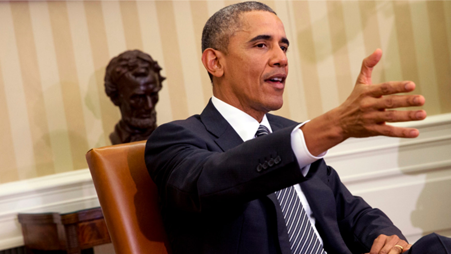 President Barack Obama speaks to the media during a meeting with Secretary of Defense Ash Carter in the Oval Office of the White House, Tuesday, Feb. 17, 2015, in Washington. The President spoke about issues including immigration and ISIS. (AP Photo/Jacquelyn Martin)