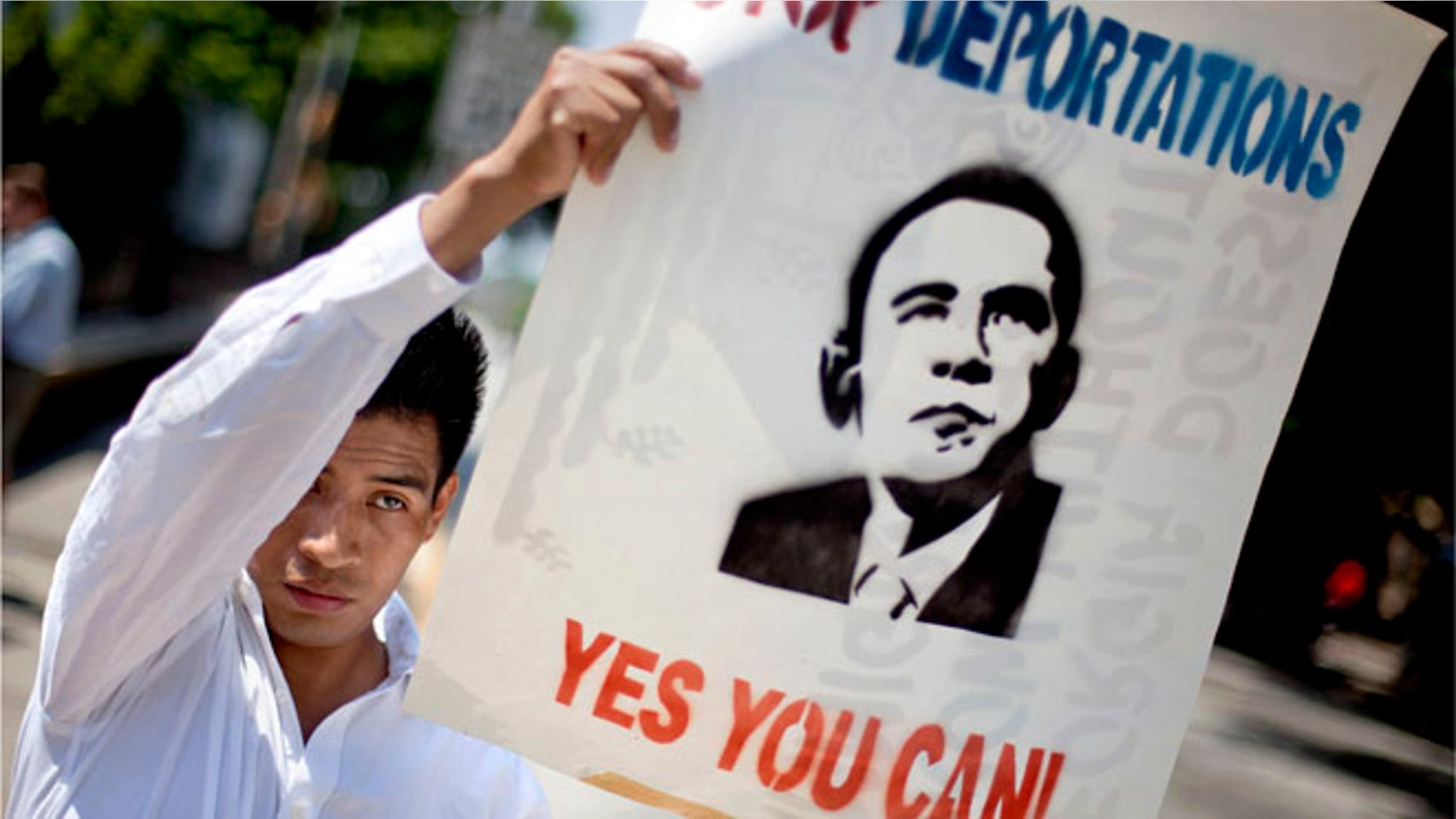 A demonstrator rallies in front of the Georgia Capitol Tuesday, May 1, 2012, in Atlanta. (AP Photo/David Goldman)