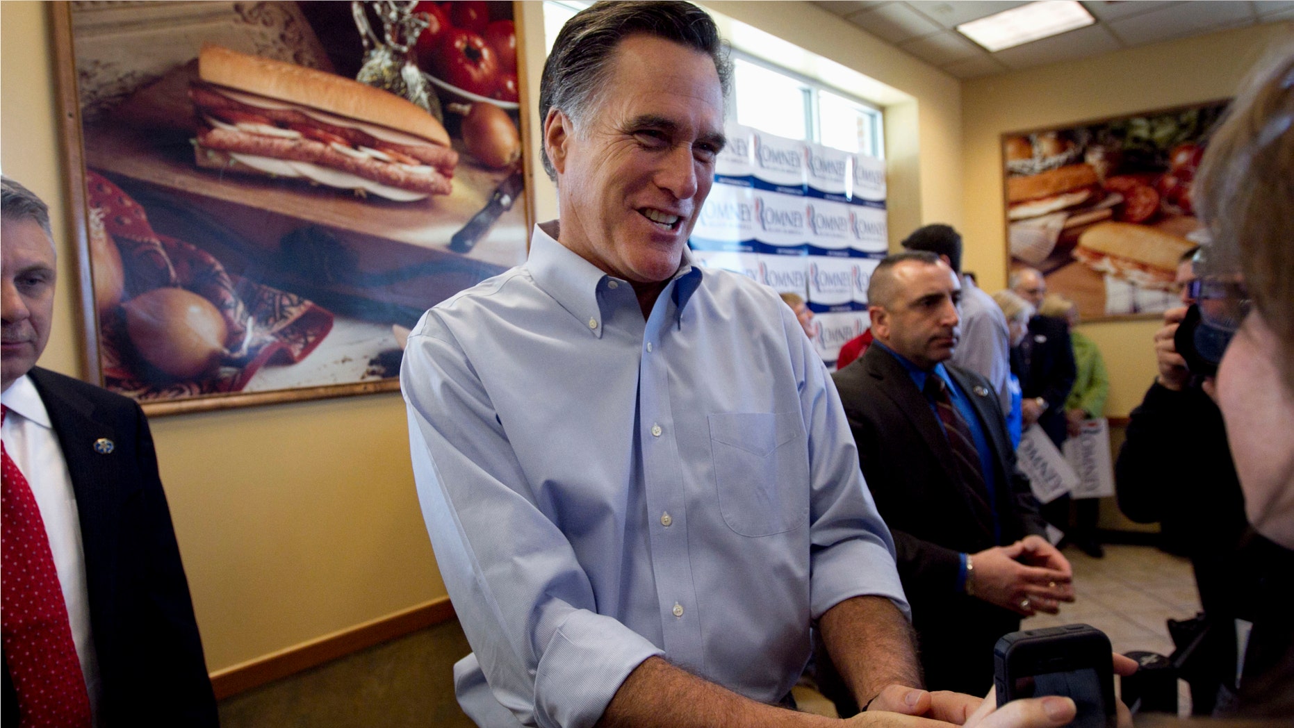 Republican presidential candidate, former Massachusetts Gov. Mitt Romney greets people during a campaign stop at a Cousins Subs fast food restaurant, in Waukesha, Wis., Tuesday, April 3, 2012. (AP Photo/Steven Senne)