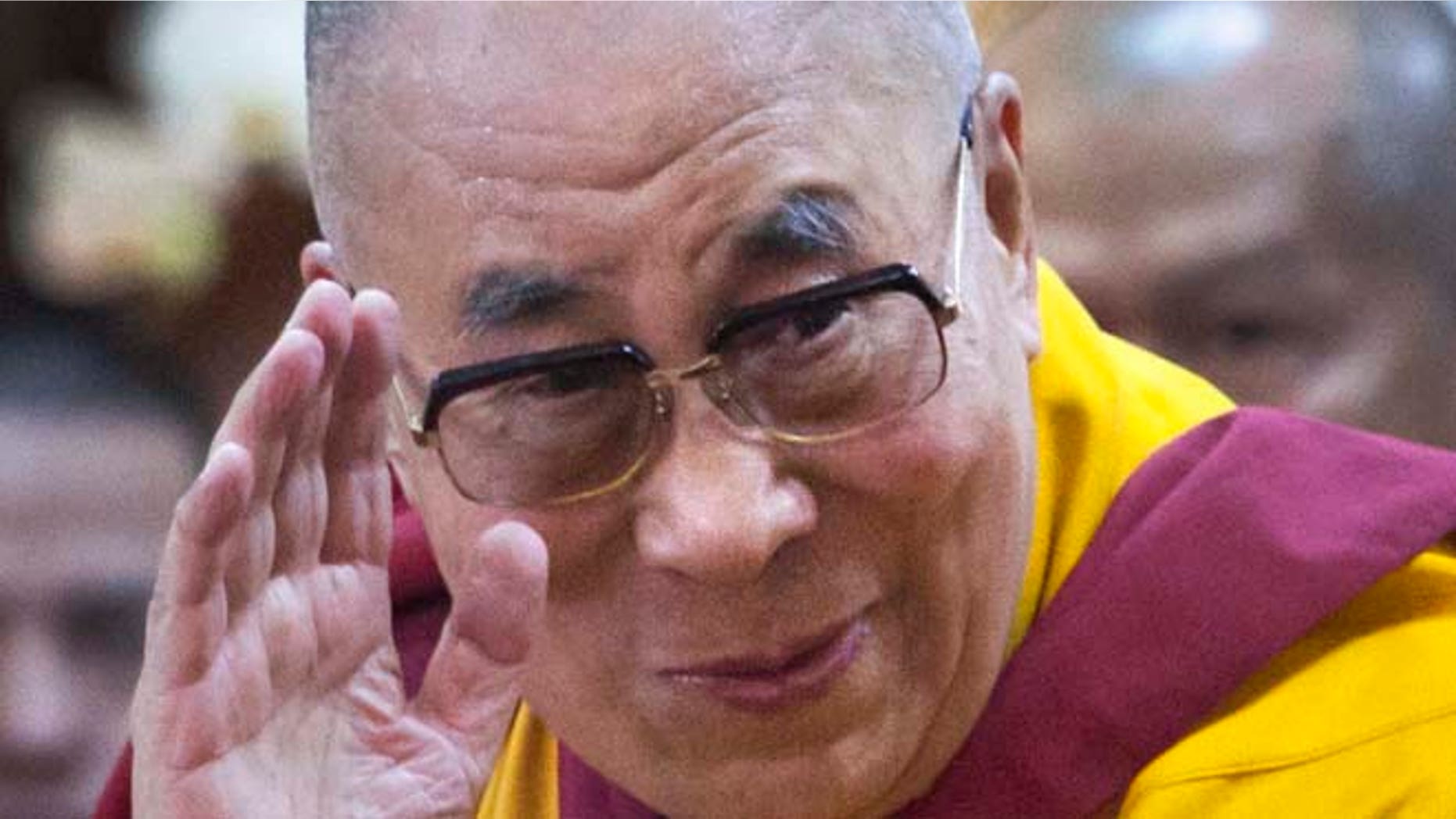 Sept. 7, 2015: Tibetan spiritual leader the Dalai Lama greets devotees as he arrives to give a talk at the Tsuglakhang temple in Dharmsala, India.