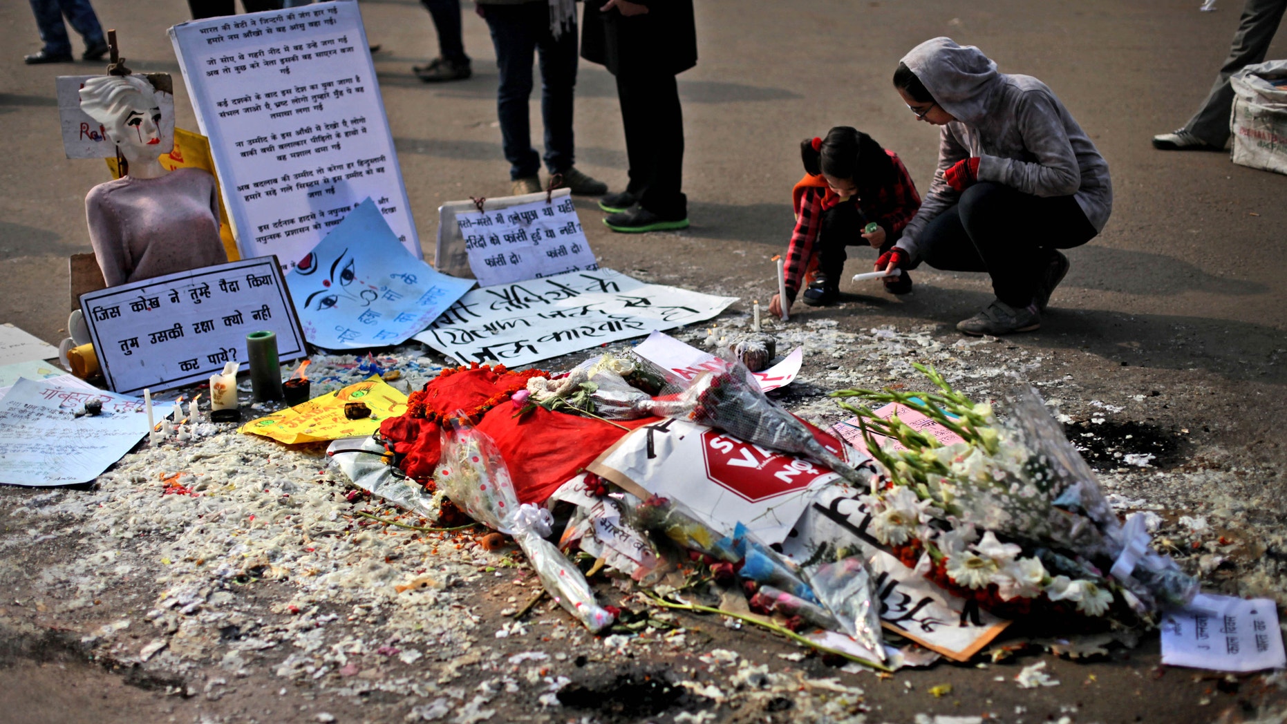 Jan. 3, 2013 - A young Indian girl lights a candle in memory of a gang-rape victim in New Delhi, India.