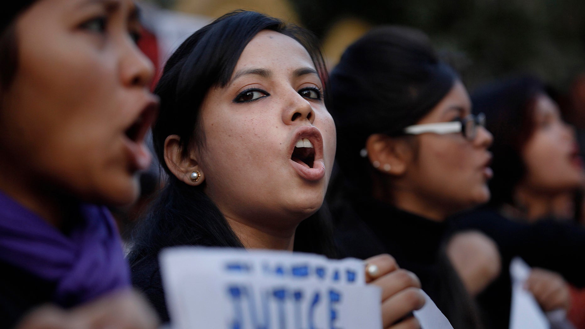 Jan. 3, 2012: Students shout slogans during a protest against a leader of the ruling Congress party, who was arrested on accusations he raped a woman in a village in the early hours of the morning, in Gauhati, India.