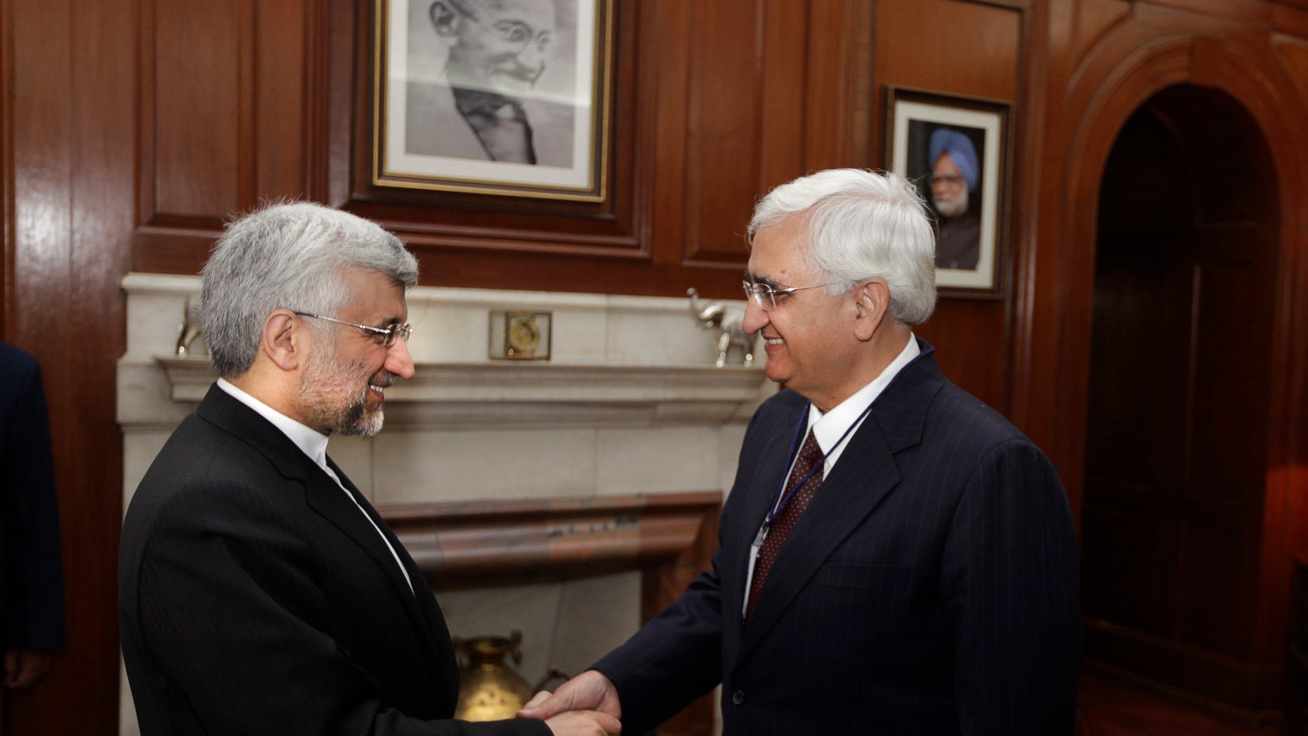 Jan. 4, 2013 - Indian Foreign Minister Salman Khurshid, right, shakes hands with Iran's Supreme National Security Council Secretary and chief Nuclear negotiator Saeed Jalili, in New Delhi, India.