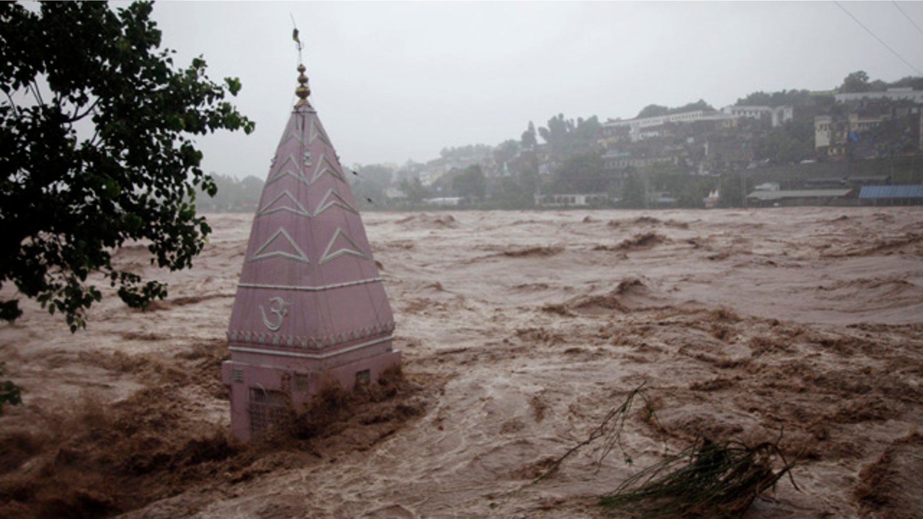 September 6, 2014: A temple is partially submerged in floodwaters in Jammu, India. (AP Photo/Channi Anand)