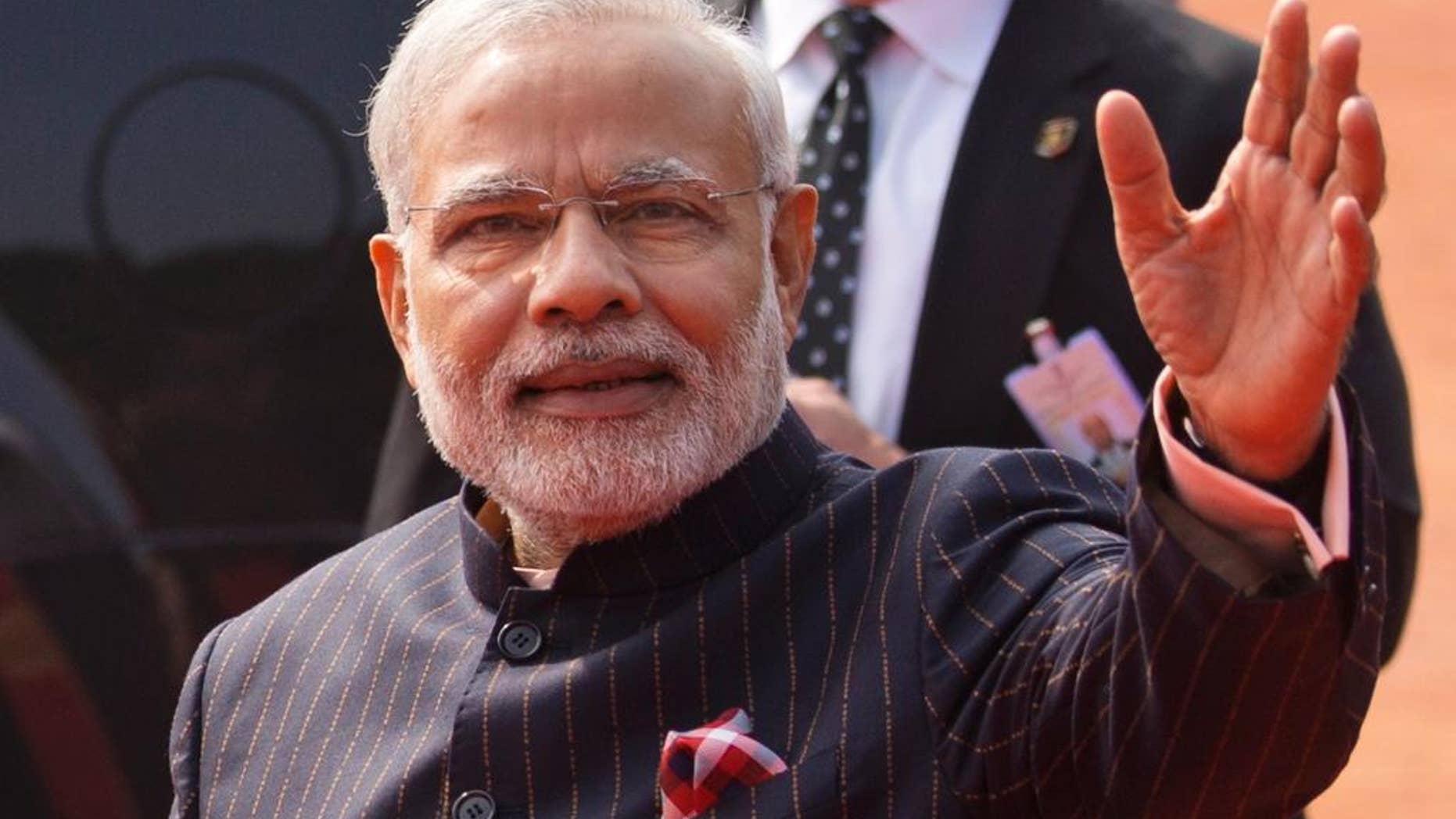 Jan. 25, 2015: Indian Prime Minister Narendra Modi waves during a reception for President Obama in New Delhi.