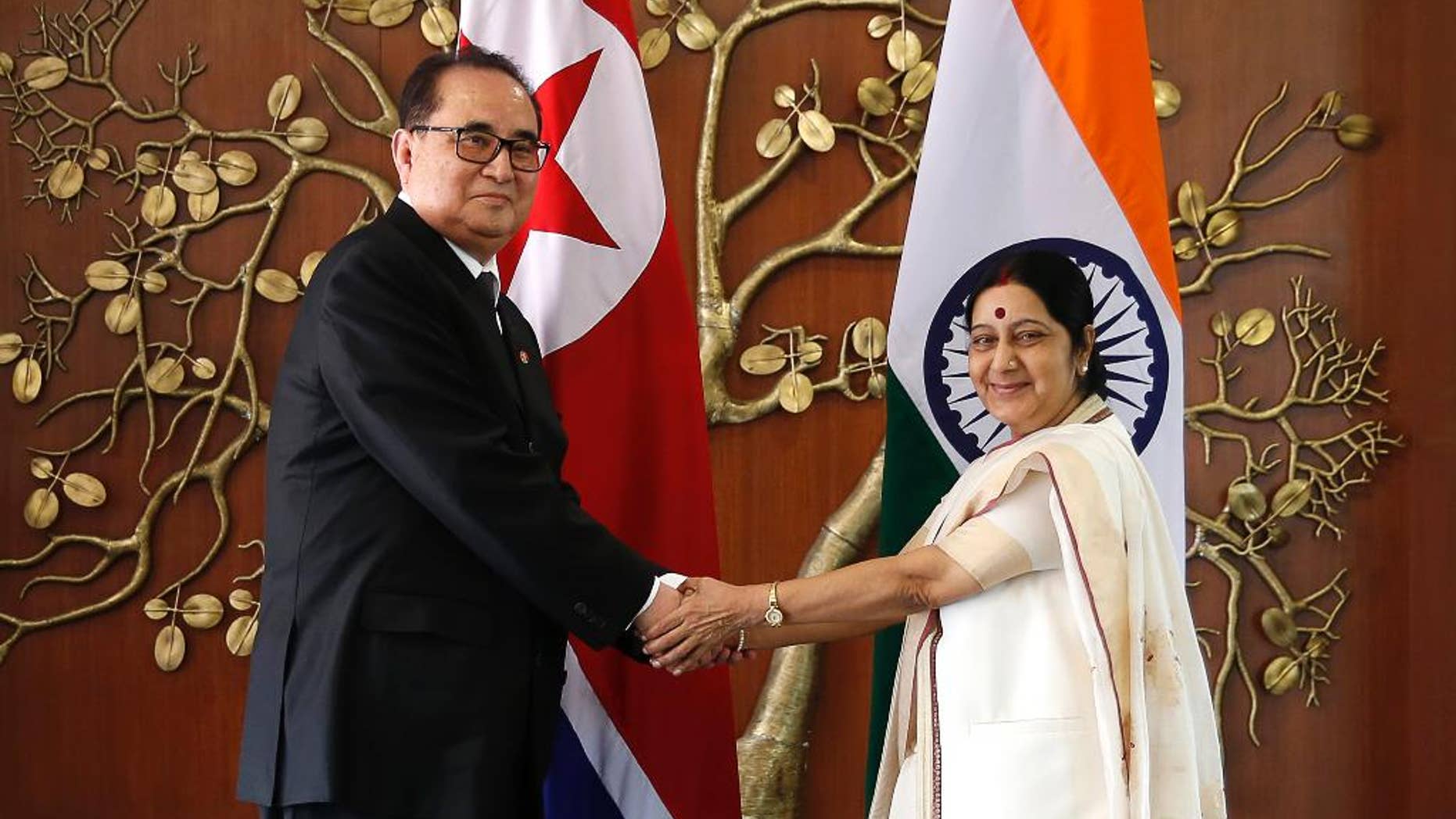 FILE – In this Monday, April 13, 2015 file photo, Indian Foreign Minister Sushma Swaraj, right, shakes hands with North Korea's Foreign Minister Ri Su Yong in New Delhi, India. Ties are warming between New Delhi and Pyongyang, with mineral-hungry India looking to boost trade while North Korea, facing sometimes-rocky relations with China, searches for new friends. The goodwill began earlier this year, when North Korea dispatched Ri on a three-day trip to India, just a few weeks before Prime Minister Narendra Modi flew to Seoul for meetings with South Korean President Park Geun-hye. (AP Photo/Manish Swarup, File)