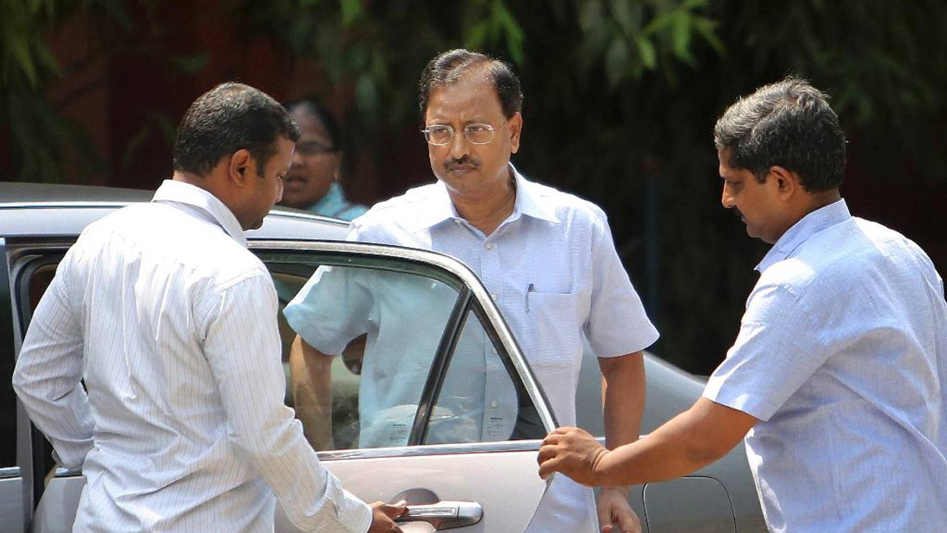 Satyam Computer Services founder B. Rama Raju, centre, arrives at a court in Hyderabad, India, Thursday, April 9, 2015. An Indian court on Thursday convicted Raju, the founder of the outsourcing giant and nine others on charges of stealing millions of dollars in one of the largest frauds in the country's corporate history. (AP Photo/Mahesh Kumar A.)