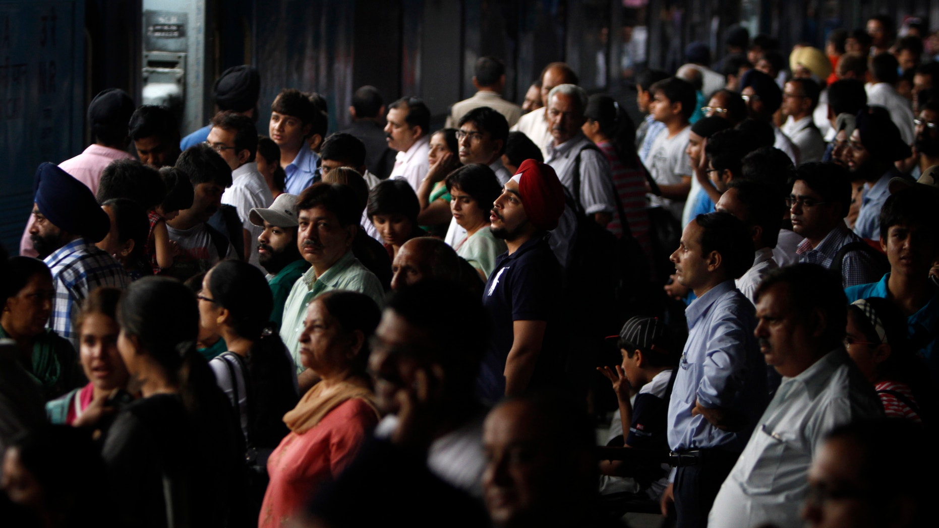 July 30, 2012: Stranded passengers wait for their power to get restore, at New Delhi railway station, in New Delhi, India.
