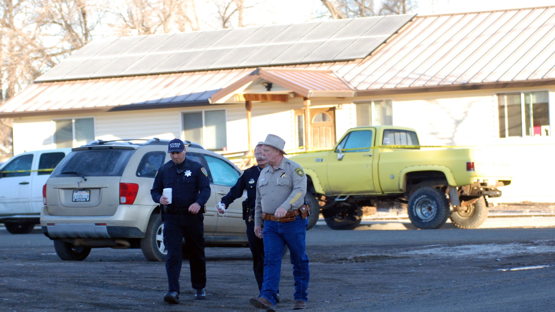 Feb. 21, 2014: Modoc County Sheriff and Coroner Mike Poindexter, right, walks away from the Cedarville Rancheria tribal headquarters building in Alturas, Calif.