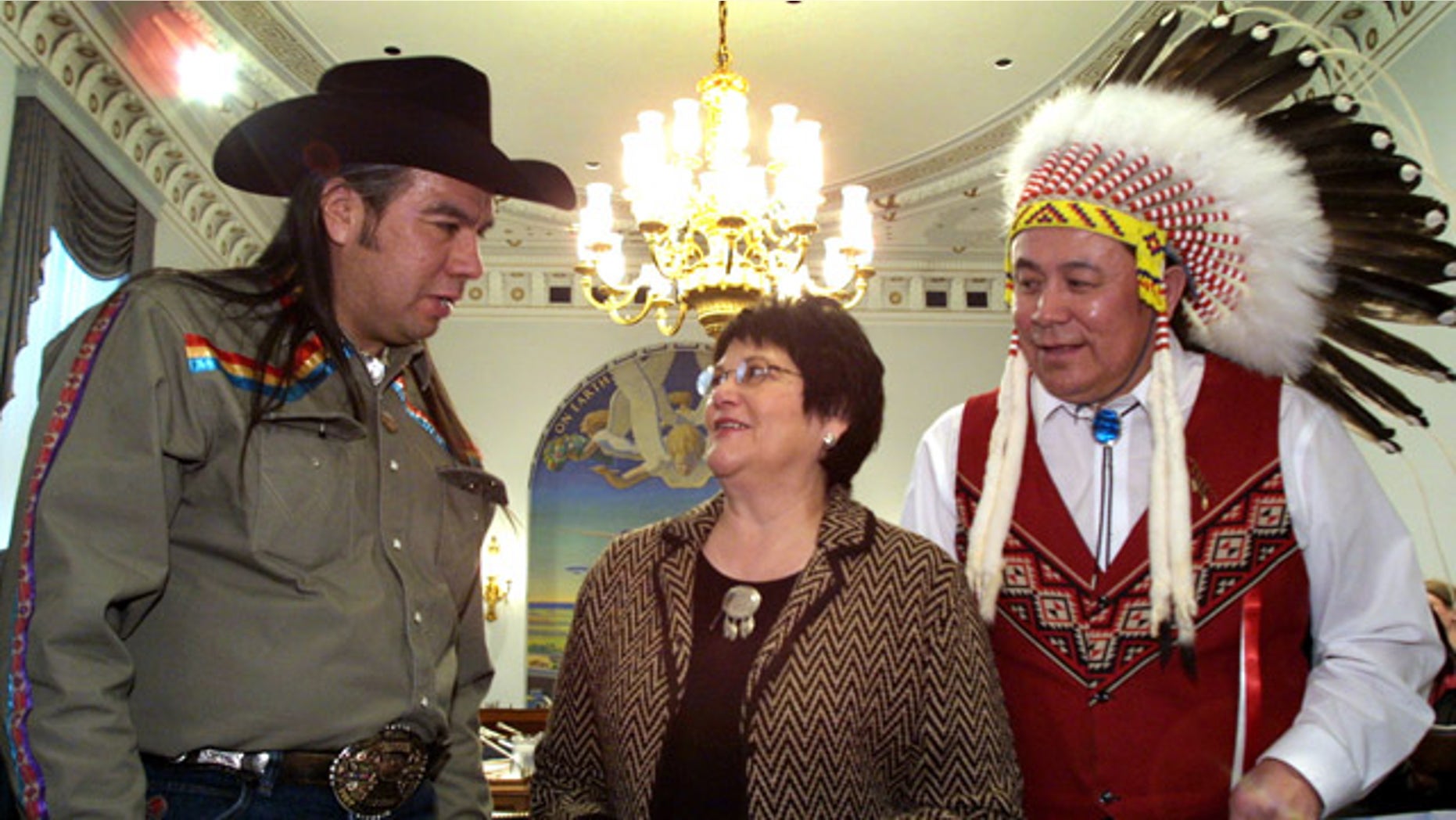 FILE - A Feb. 6, 2002 file photo shows National Congress of American Indians President Tex Hall, left, with Elouise Cobell of the Blackfeet Tribe of Montana, center, and Jimmy Goddard, from the same tribe, on Capitol Hill. Settlement payments among hundreds of thousands of Native Americans whose land-trust royalties were mismanaged by the government for more than a century have been held up by more than 2,400 appeals by people who were ruled ineligible to participate in the settlement. (AP Photo/Terry Ashe, File)