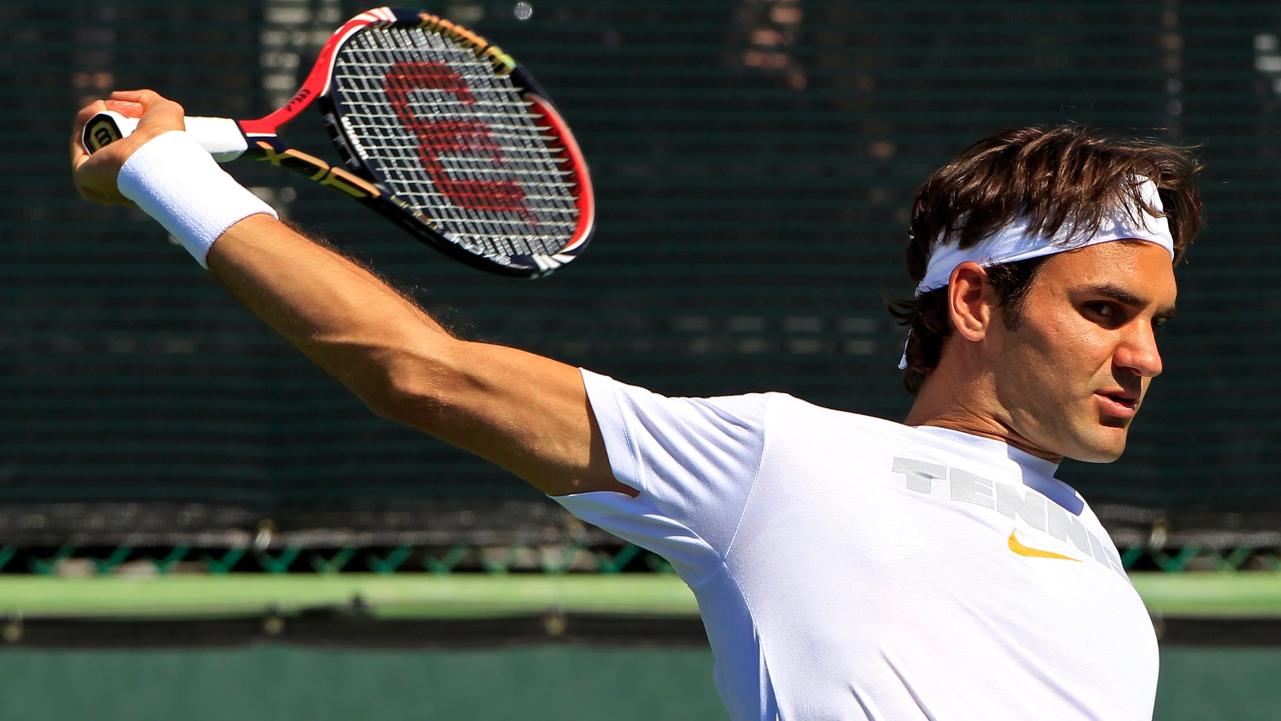 March 10: Roger Federer of Switzerland returns a shot as he practices for the BNP Paribas Open tennis tournament in Indian Wells, Calif. Federer told reporters he is happy with his form as he prepares for his first-round match.