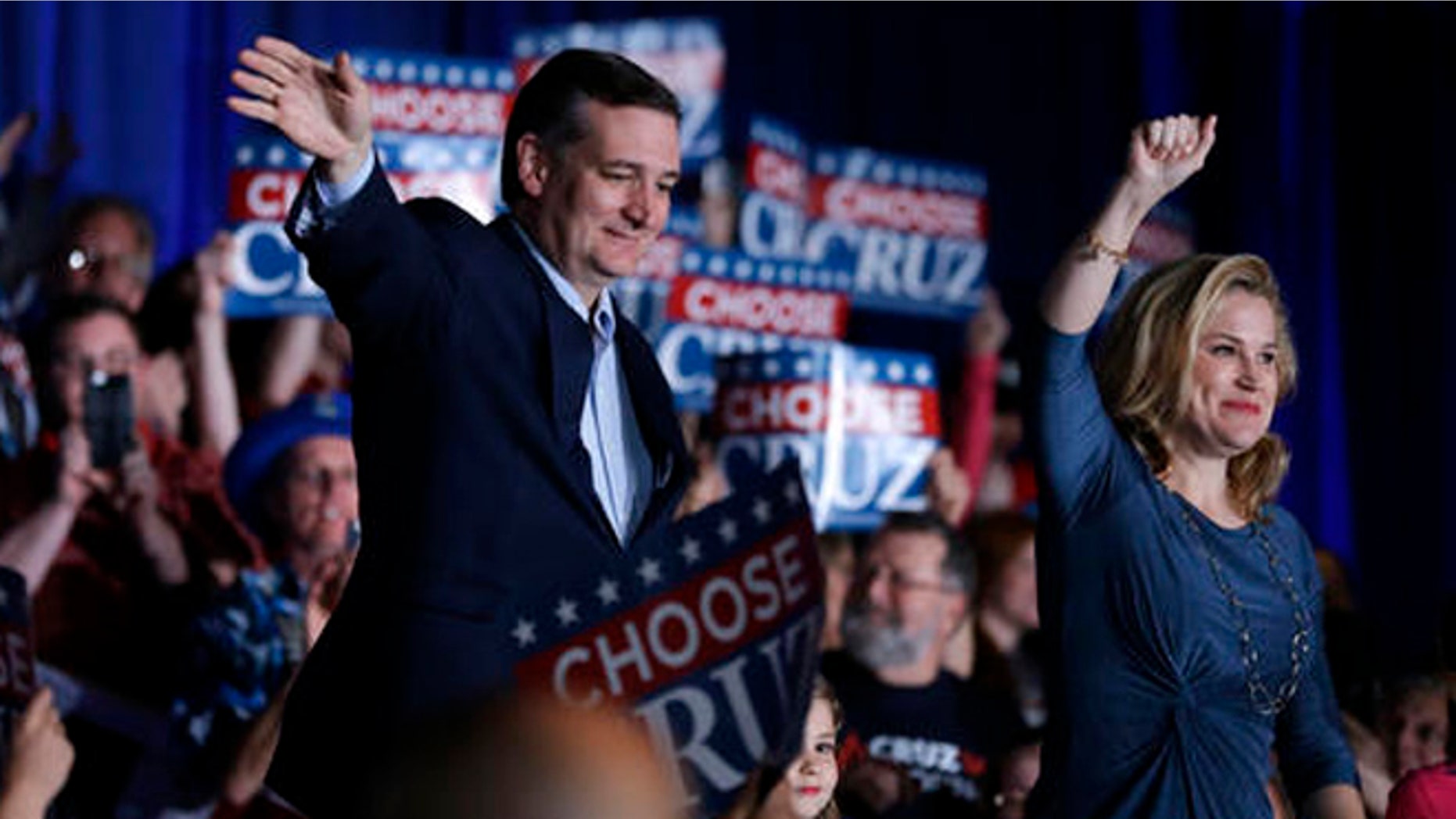 Republican presidential candidate Sen. Ted Cruz, R-Texas, waves with his wife Heidi at a rally at the Indiana State Fairgrounds in Indianapolis, Monday, May 2, 2016. (AP Photo/Michael Conroy)