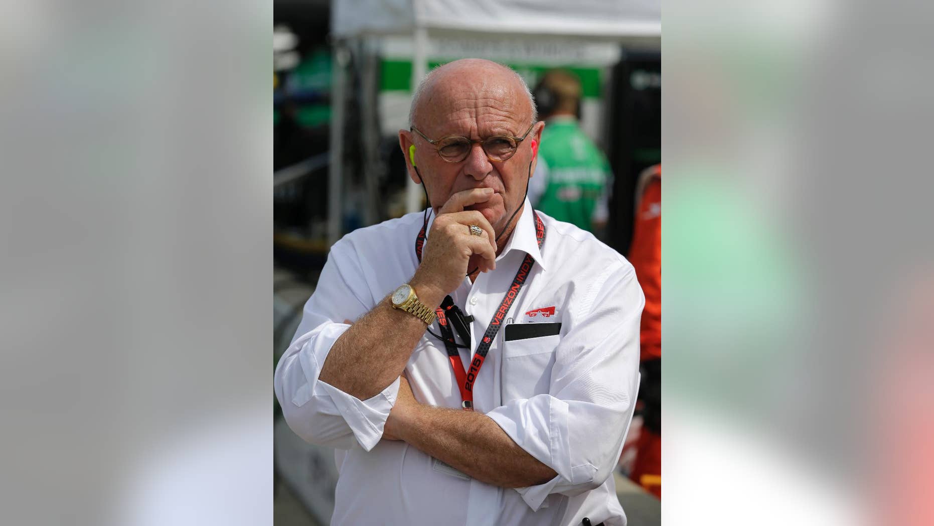 In this photo taken on Friday, May 8, 2015, Derrick Walker, President of operations and competition of IndyCar watches during practice for the Grand Prix of Indianapolis auto race at the Indianapolis Motor Speedway in Indianapolis. Derrick Walker might be one of the most liked officials in the IndyCar Series. He also has one of the toughest jobs. (AP Photo/Darron Cummings)