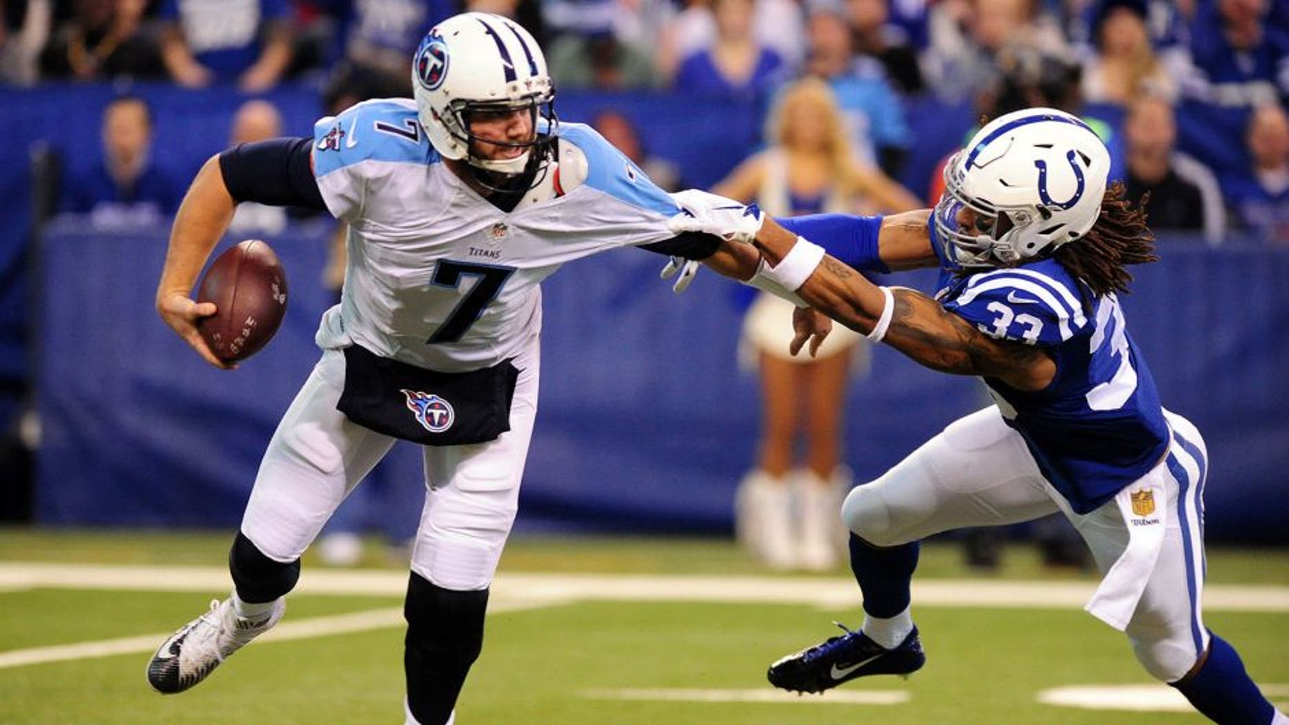 Jan 3, 2016; Indianapolis, IN, USA; Indianapolis Colts safety Dwight Lowery (33) pressures quarterback Tennessee Titans quarterback Zach Mettenberger (7) at Lucas Oil Stadium. Mandatory Credit: Thomas J. Russo-USA TODAY Sports