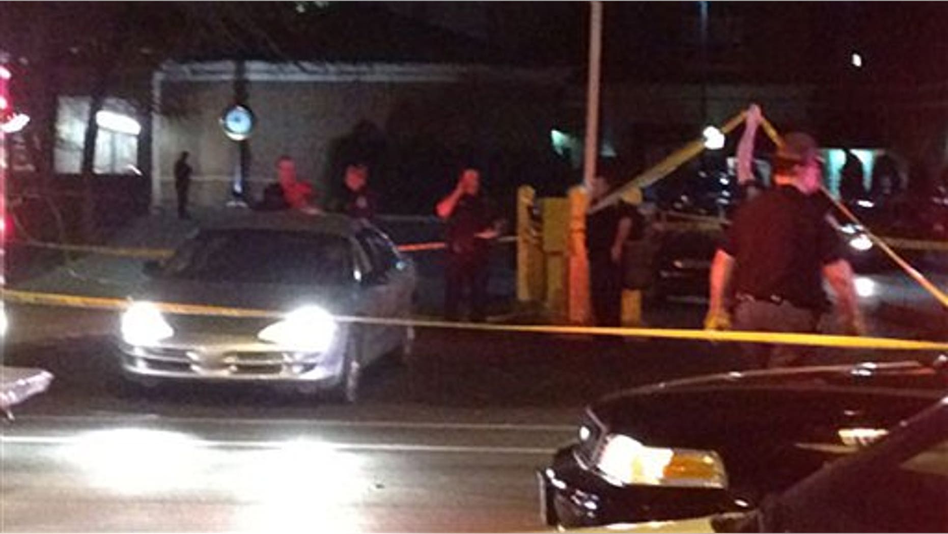 March 17: In this frame grab from video provided by WTHR-TV13 in Indianapolis, authorities investigate the scene where gunfire erupted from a car as throngs were celebrating St. Patrick's Day near the popular Downtown Canal in Indianapolis.