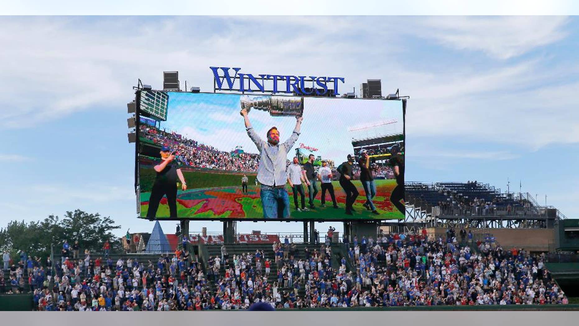 The Chicago Blackhawks parade the Stanley Cup inside Wrigley Field before an interleague baseball game between the Chicago Cubs and the Cleveland Indians Tuesday, June 16, 2015, in Chicago. (AP Photo/Charles Rex Arbogast)
