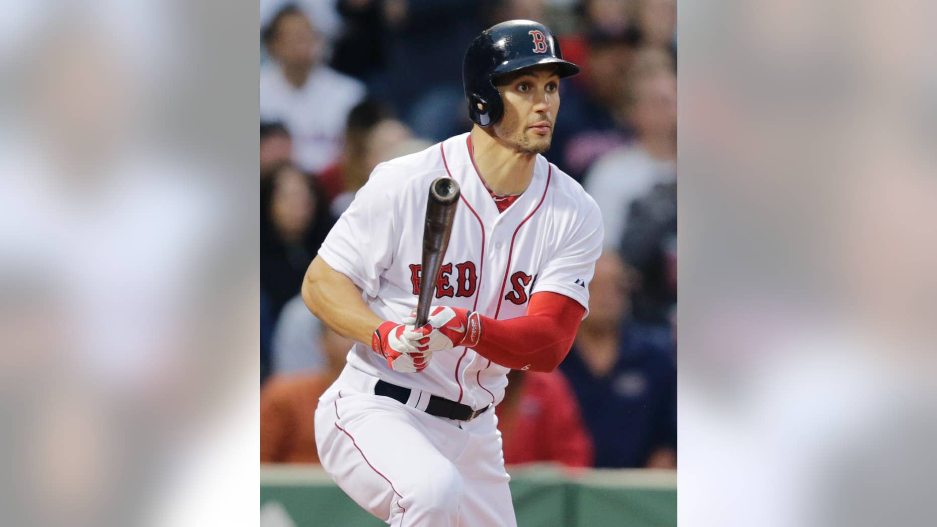 Boston Red Sox's Grady Sizemore watches his ground-rule double, which scored Mike Napoli, hit off Cleveland Indians starting pitcher Josh Tomlin during the second inning of a baseball game in Boston, Thursday, June 12, 2014. (AP Photo/Charles Krupa)
