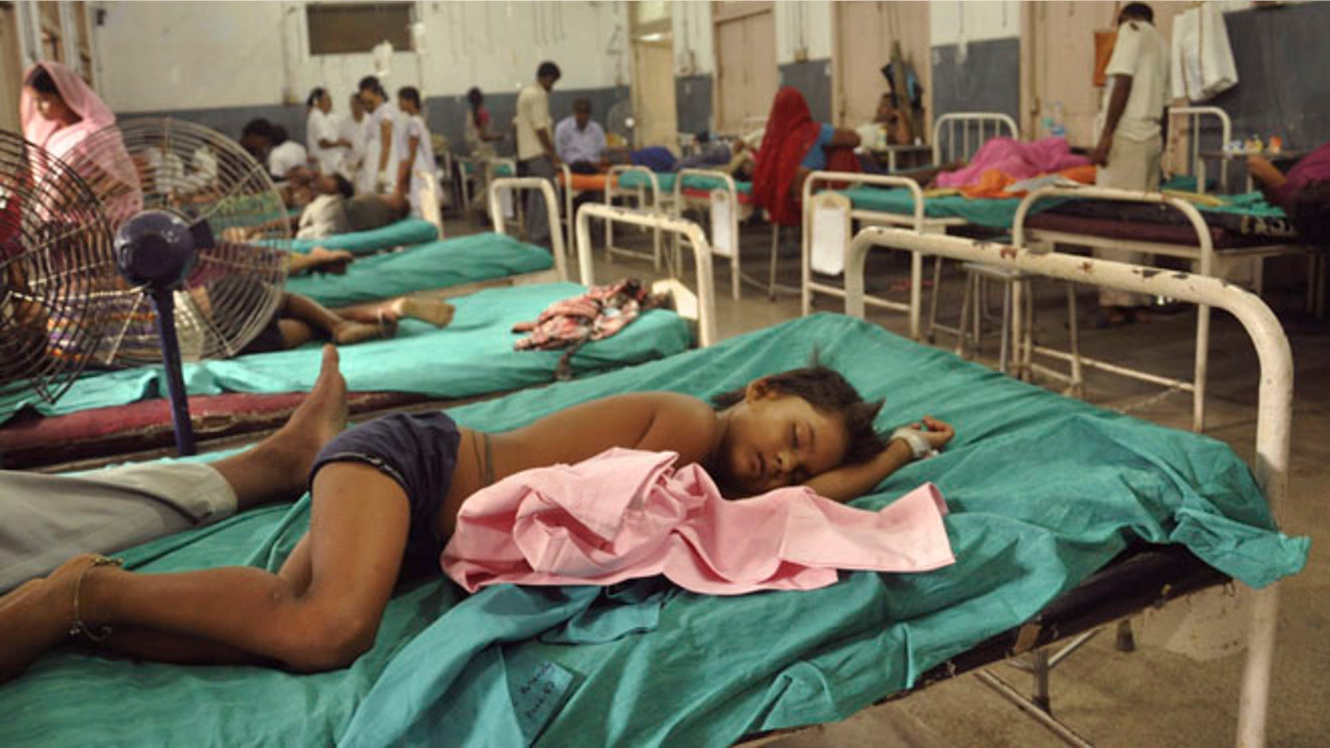 July 17, 2013: In this file photograph, Indian children who fell sick after eating a free school lunch lie at a hospital in Patna, India.