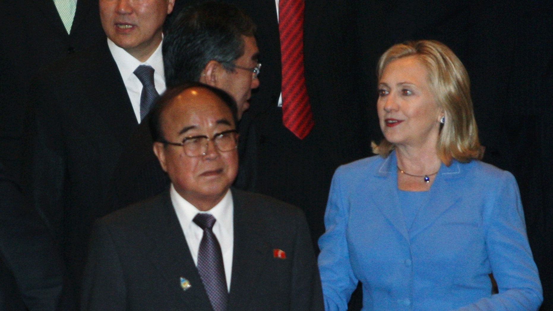 South Korean Foreign Minister Kim Sung-hwan, top left, walks by his North Korean counterpart Pak Ui Chun, bottom center, as U.S. Secretary of State Hillary Rodham Clinton talks with Japanese Foreign Minister Takeaki Matsumoto, center, prior to the start of ARF Retreat Session in Nusa Dua, Bali, Indonesia, Saturday, July 23, 2011.
