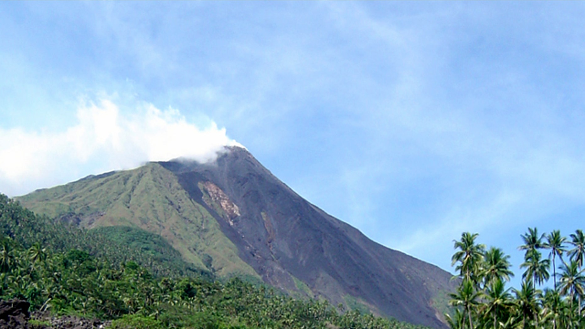 Debris from the Mount Karangetang volcano lies on the shoulder of the mountain in Siau, part of Indonesia's Sulawesi island chain, in this July 27, 2006 file photo.