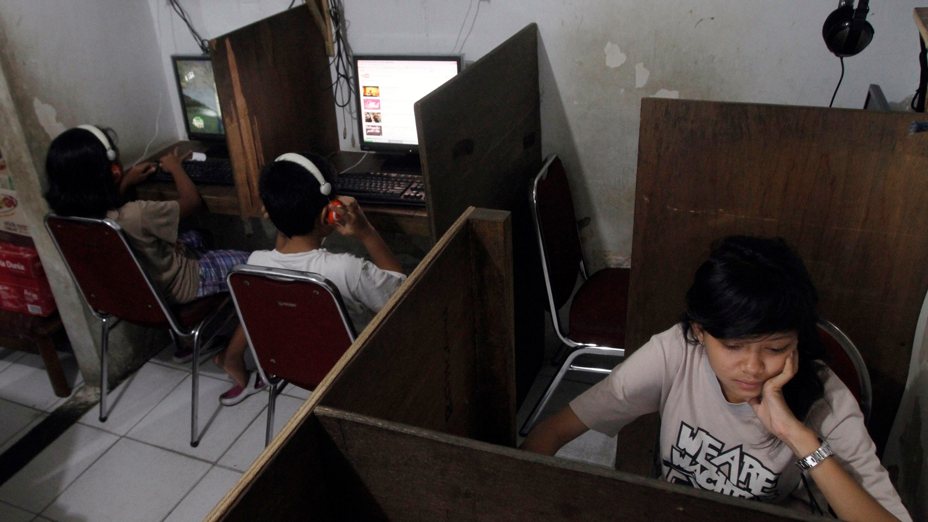 Oct. 19, 2012: Indonesian youths browse at an internet cafe in Jakarta, Indonesia.